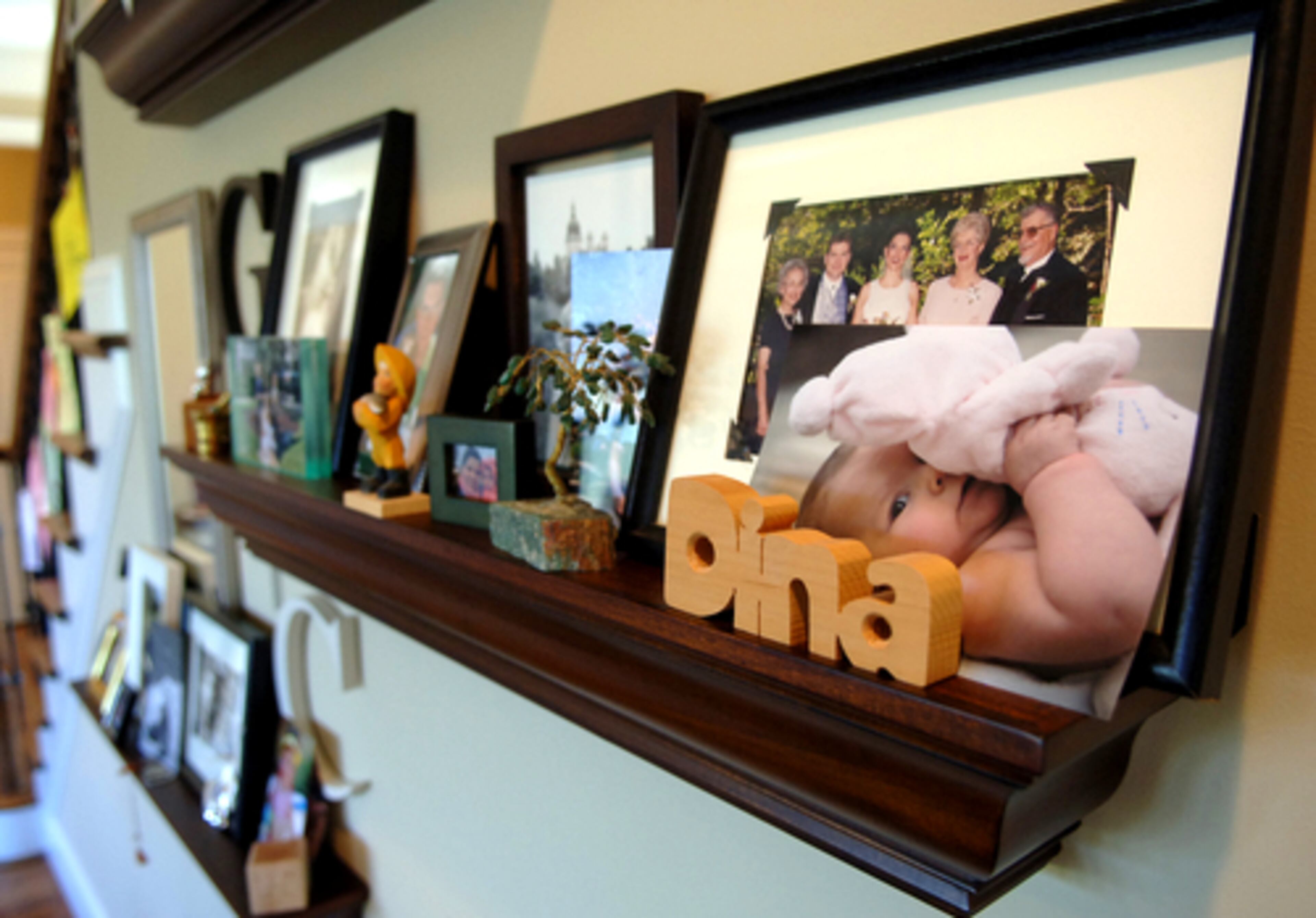 Dina Gundersen likes to display her framed photos on shelves, making swapping them out an easy task.