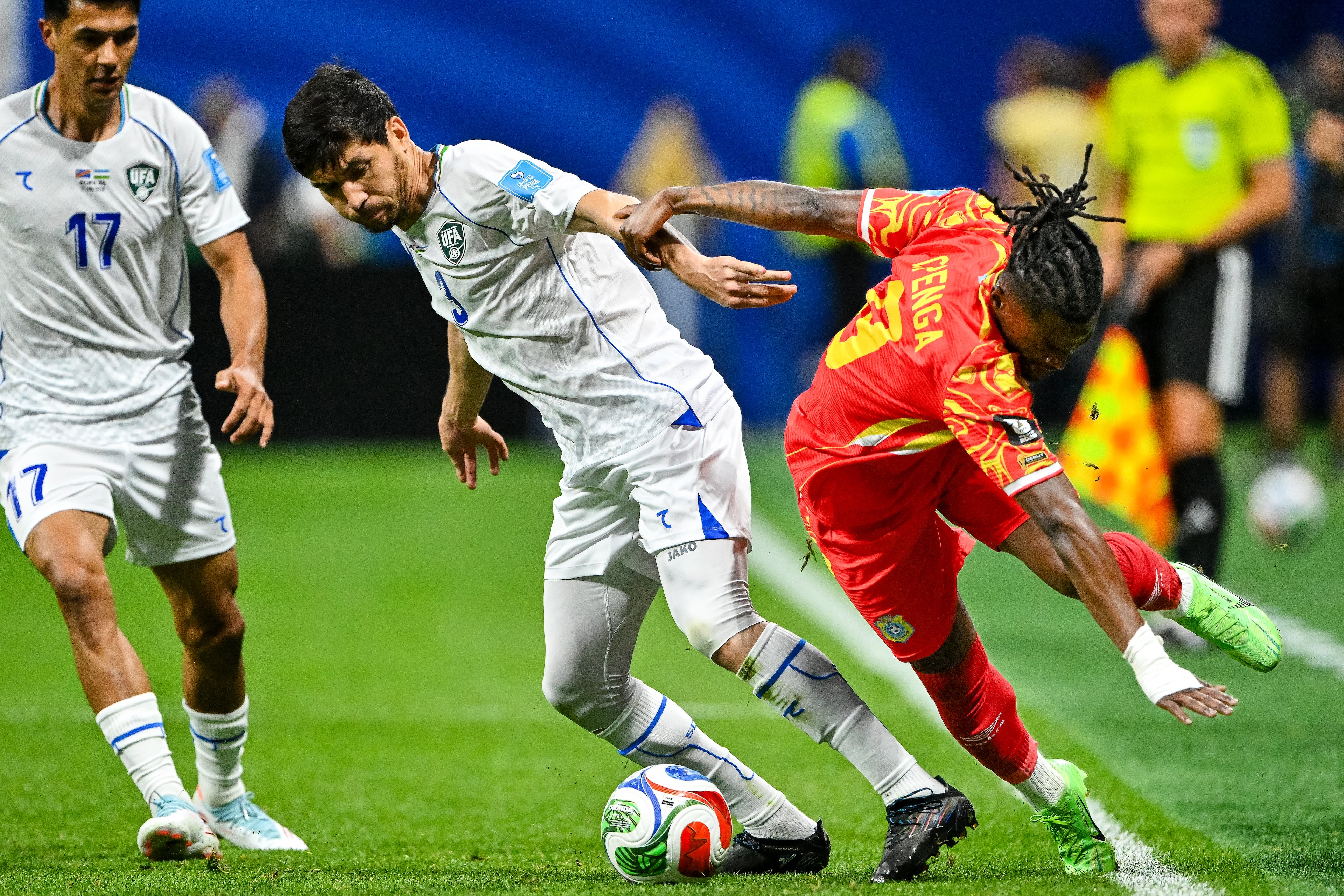 Congo forward Brian Cipenga (right) and Uzbekistan defender Khojiakbar Alijonov battle for control of the ball during the first half of a FIFA World Cup match at Atlanta Stadium (Mercedes-Benz Stadium) on Saturday, June 27, 2026, in Atlanta. (Hyosub Shin/AJC)