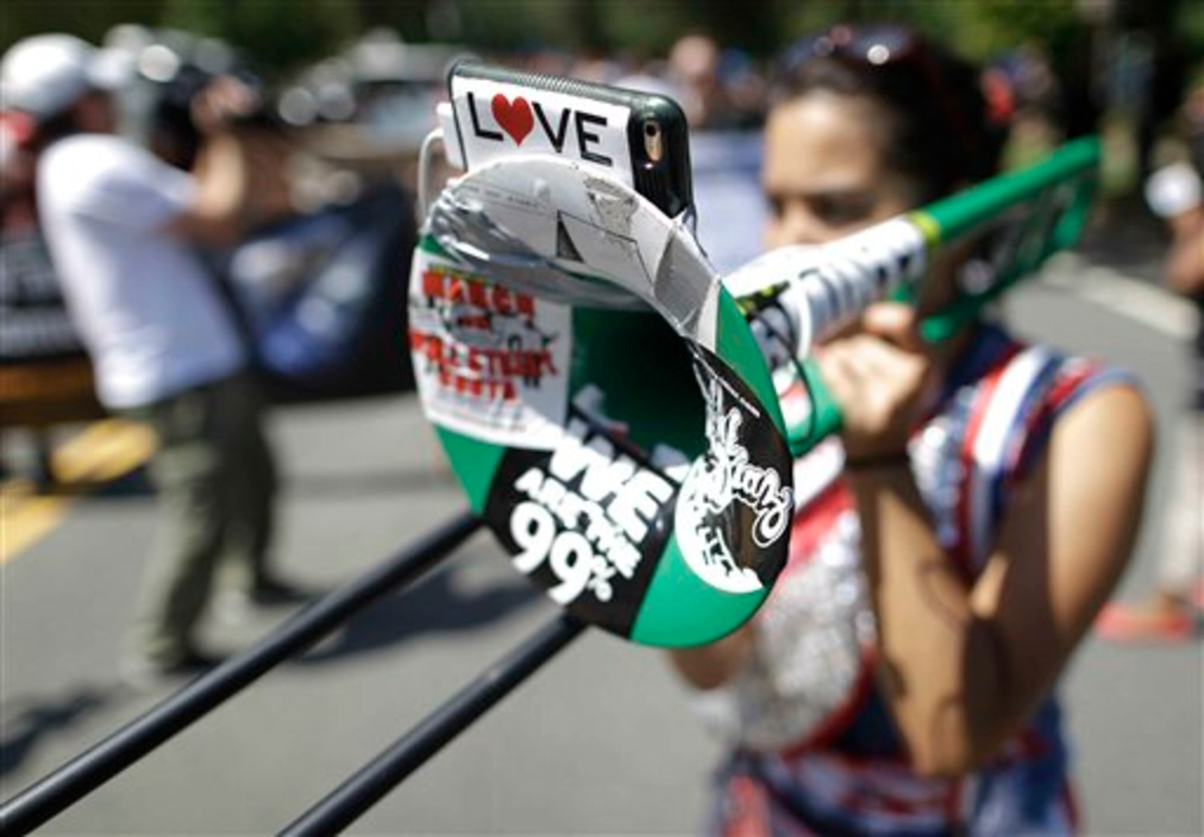 Demonstrators move toward downtown during a protest march, Sunday, Sept. 2, 2012, in Charlotte, N.C. Demonstrators are protesting before the start of the Democratic National Convention. (AP Photo/Patrick Semansky)