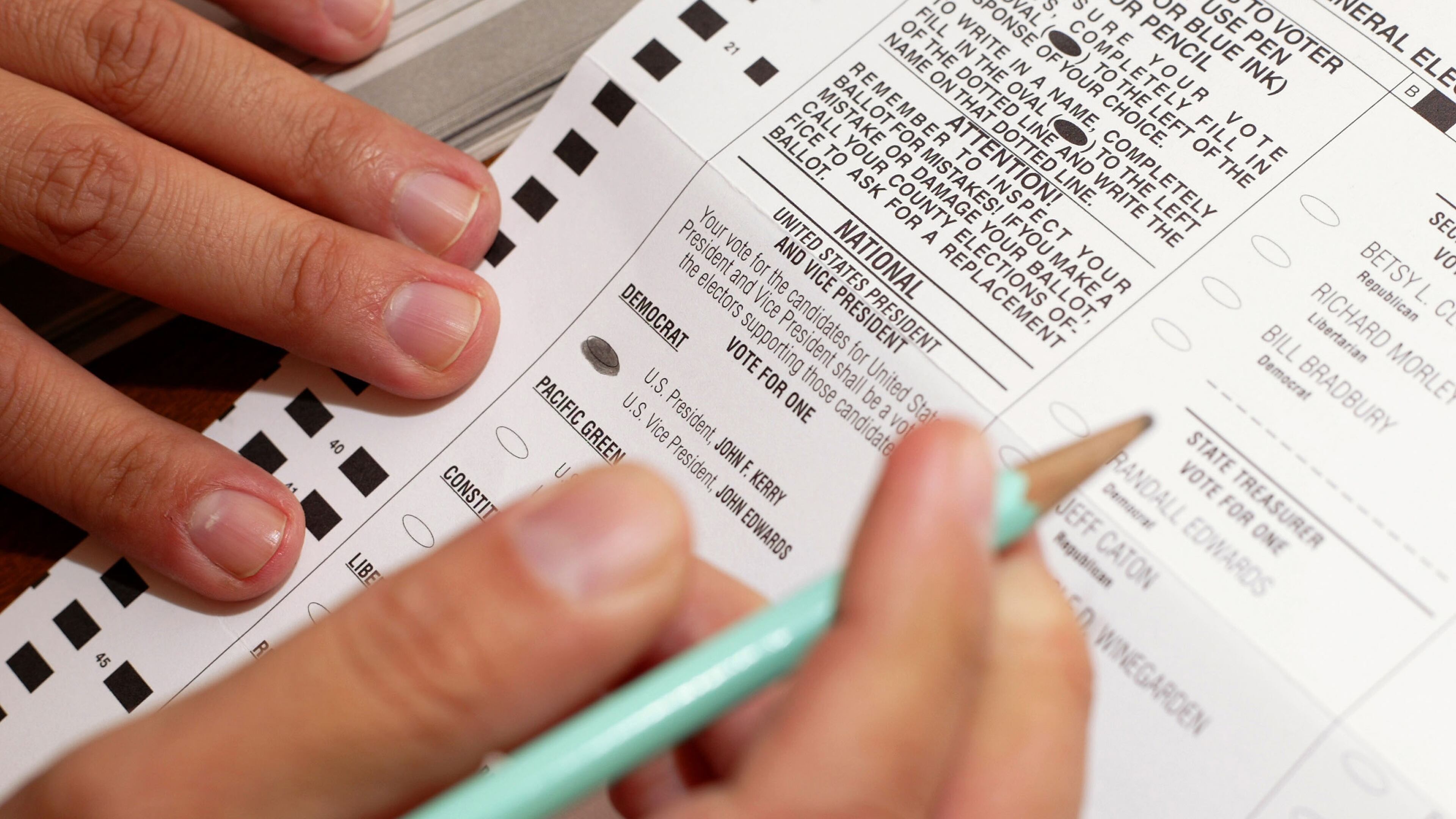 An Oregon voter casts a ballot from his home November 1, 2004 in Wilsonville, Oregon. In 2019, a group of legislators and activists in Oregon is seeking to lower the voting age from 18 to 16.