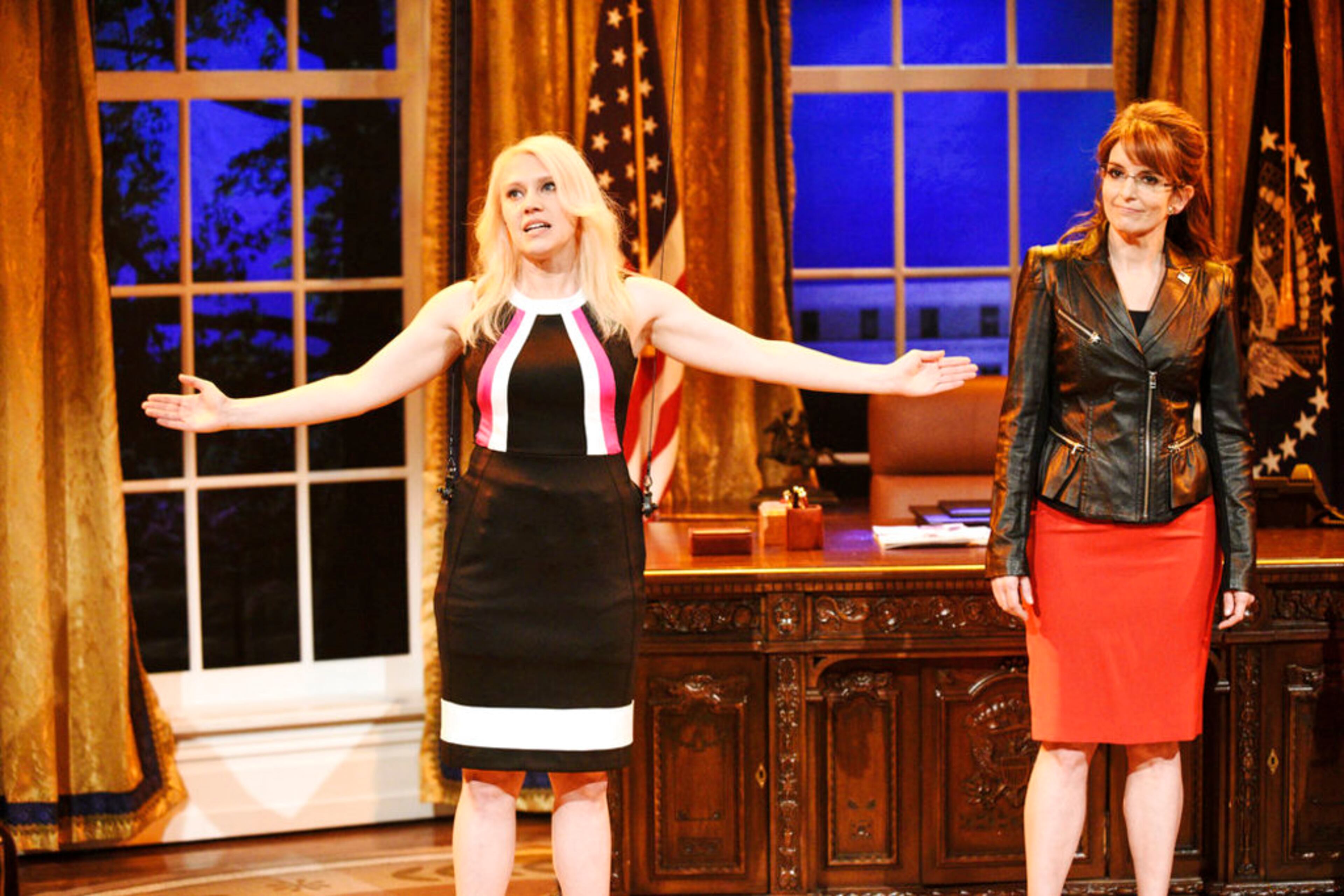 This image released by NBC shows Kate McKinnon as Kellyanne Conway, left, and Tina Fey as Sarah Palin in a sketch on "Saturday Night Live." McKinnon was nominated Thursday for an Emmy for outstanding supporting actress in a comedy series. The 70th Emmy Awards will be held on Monday, Sept. 17. (Will Heath/NBC via AP)