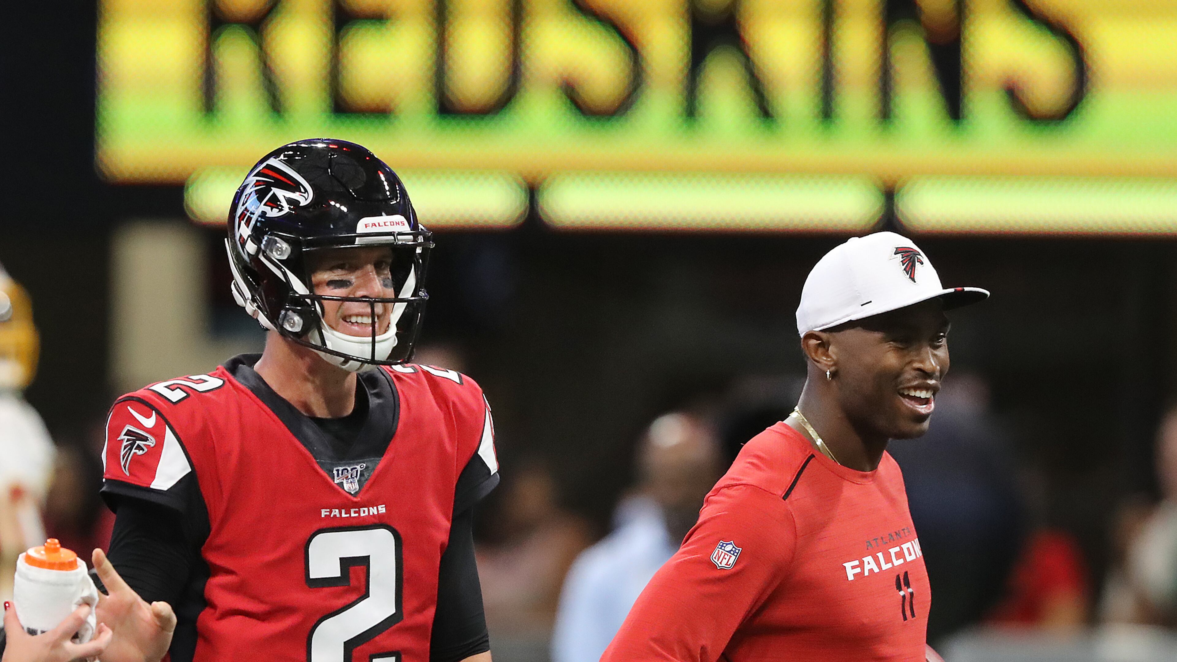 Falcons quarterback Matt Ryan and wide reciever Julio Jones, who is being held out of the game, share a laugh before the game. Curtis Compton/ccompton@ajc.com