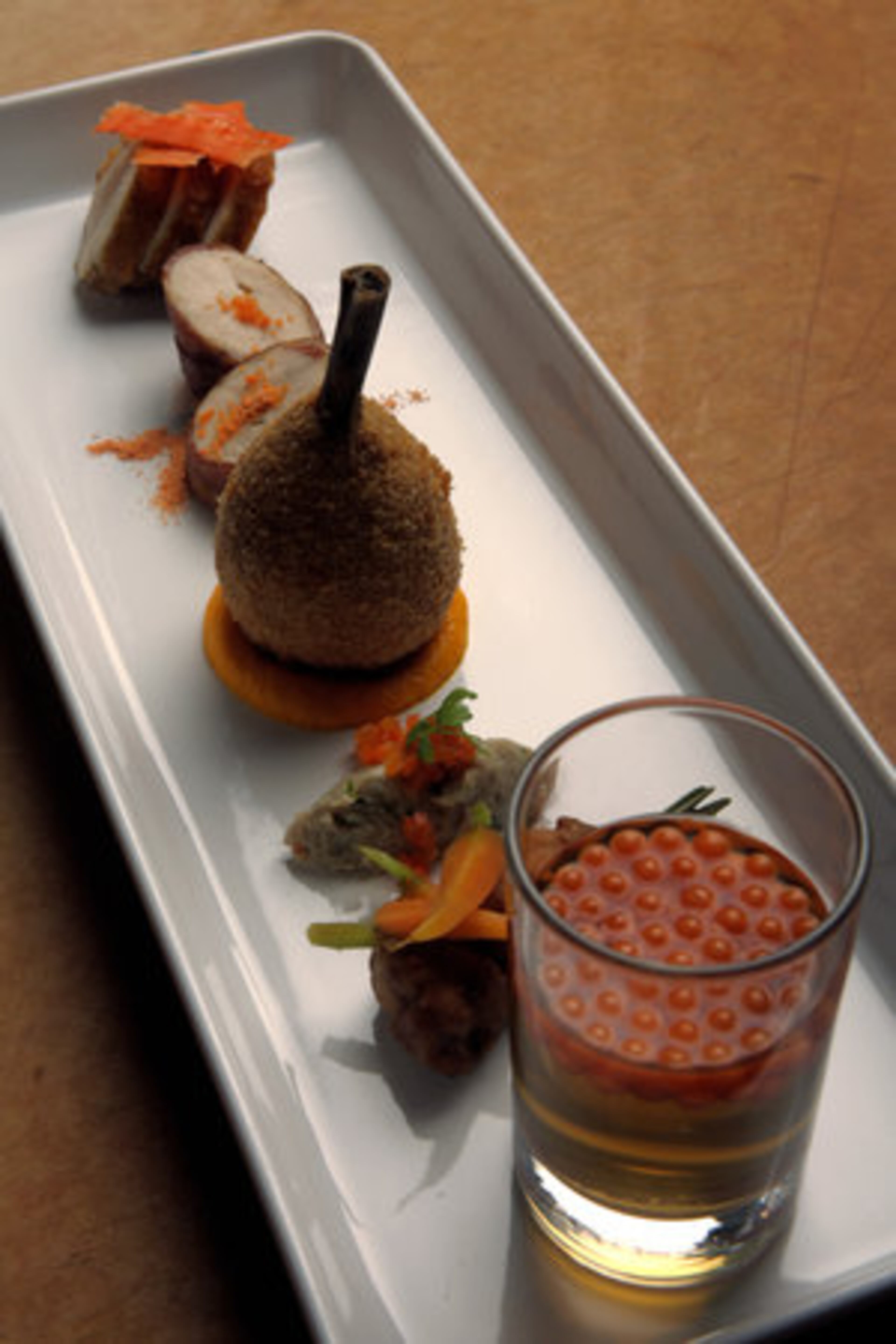 Innovative presentation techniques -- such as this Fricasseed Chicken platter -- helped the Bacchanalia owners' more upscale eatery, Quinones, rate a close second on Zagat's list of Atlanta's best restaurants.