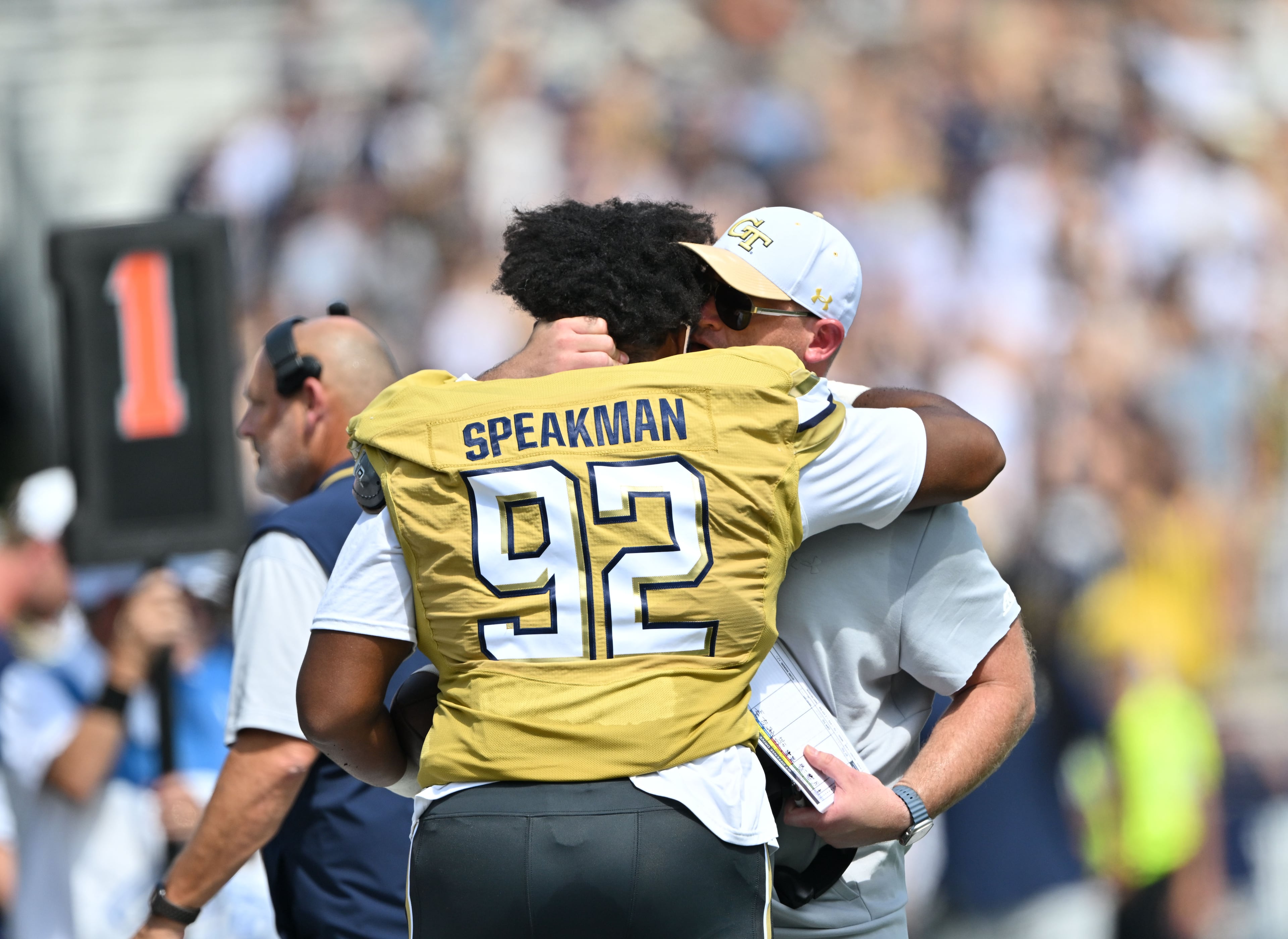 Georgia Tech defensive lineman Christian Speakman (92) gets a hug from Georgia Tech head coach Brent Key after recovering a fumble during the first half in an NCAA college football game at Bobby Dodd Stadium on Saturday, Sept. 19, 2026, in Atlanta. (Hyosub Shin/AJC)