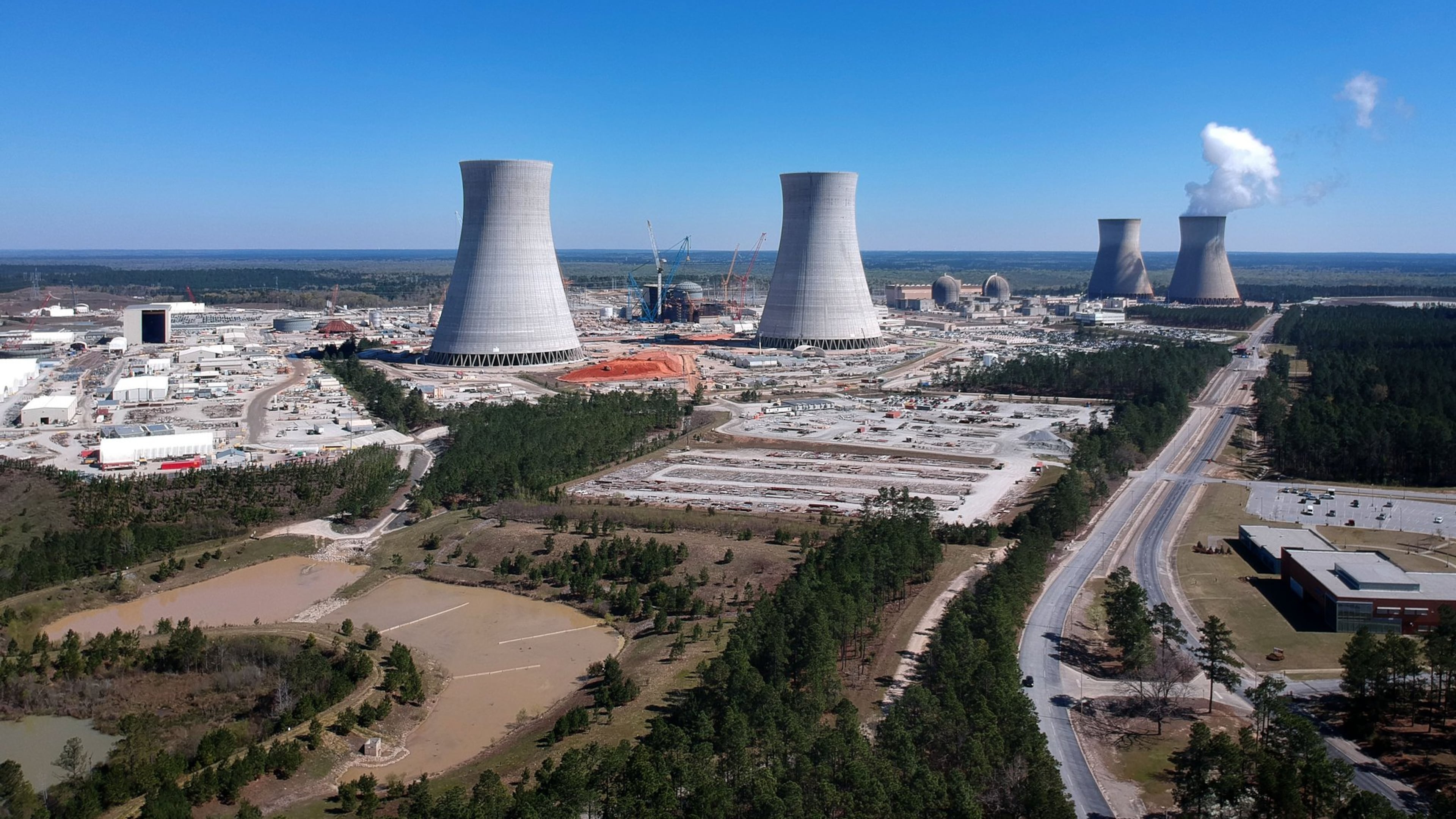 Georgia Power’s nuclear expansion of Plant Vogtle remains underway but the company's parent, Atlanta-based Southern Company, on Thursday announced more delays, something it has done repeatedly this year alone, as well as nearly a half billion dollars in additional costs for its share of of the project. The project is already years behind schedule and billions of dollars over budget. HYOSUB SHIN / HSHIN@AJC.COM