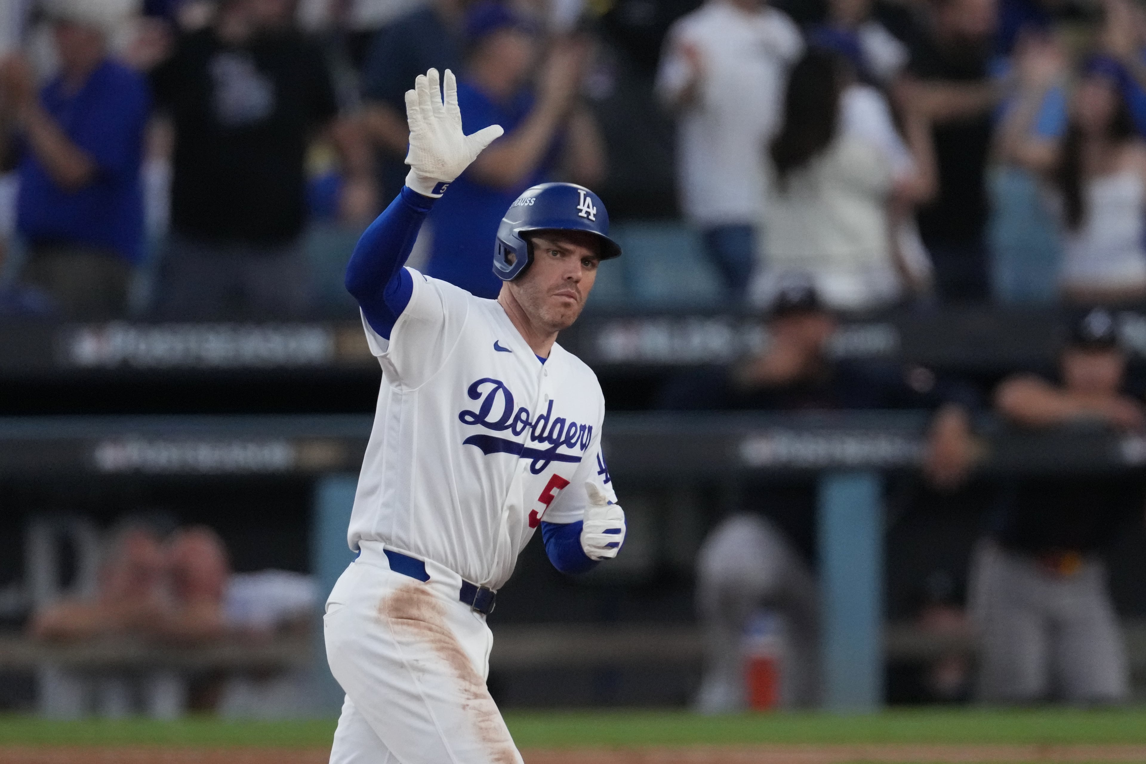 Los Angeles Dodgers' Freddie Freeman celebrates his home run during the fourth inning of Game 2 of a National League Division Series baseball game against the Atlanta Braves Sunday, Oct. 4, 2026, in Los Angeles. (AP Photo/Jae C. Hong)