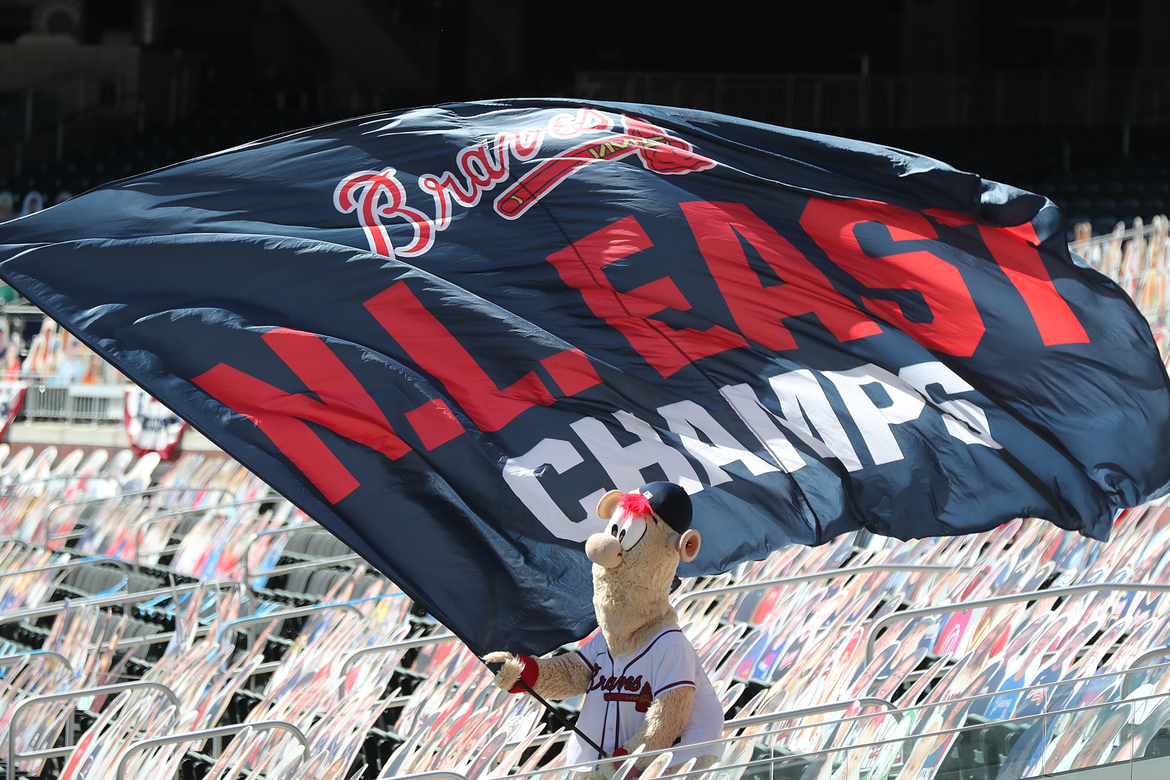 093020 Atlanta: Atlanta Braves mascot Blooper waves the N.L. East Championship flag while the Braves play the Reds during game 1 in the National League wild card playoff series on Wednesday, Sept. 30, 2020 in Atlanta. “Curtis Compton / Curtis.Compton@ajc.com”