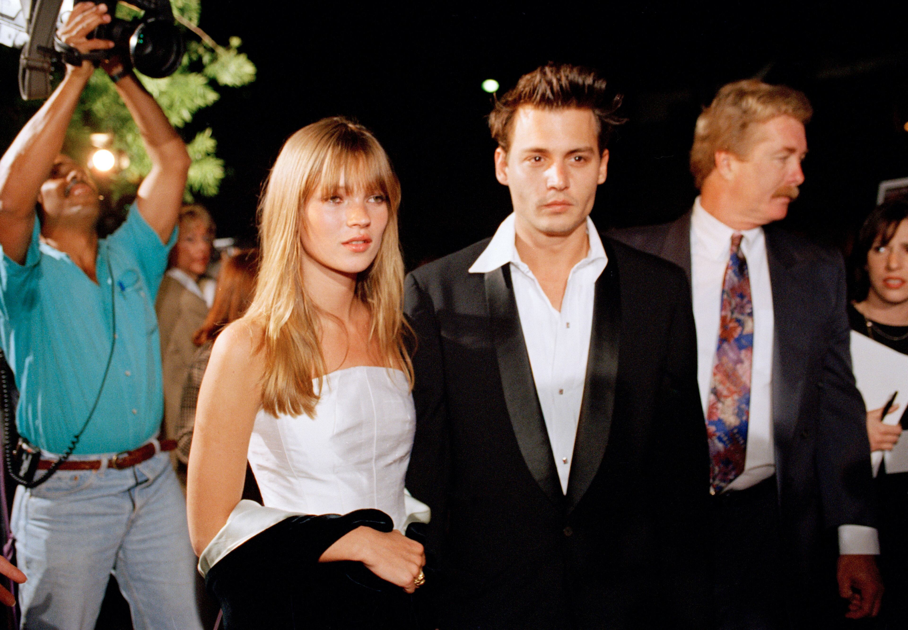 Actor Johnny Depp and his girlfriend supermodel Kate Moss are seen arriving for the premiere of Depp's film "Don Juan DeMarco," in Beverly Hills, Calif., April 3, 1995.