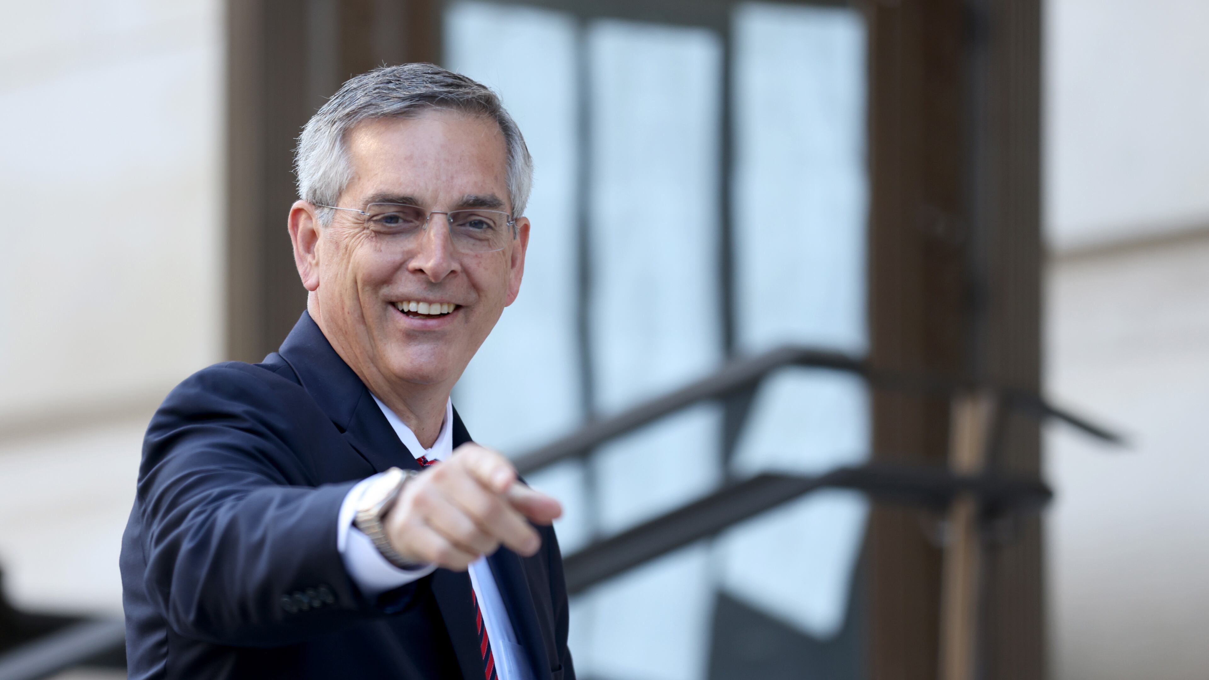 Georgia Secretary of State Brad Raffensperger reacts to members of the media as he enters the Fulton County Courthouse to testify to a grand jury involving the probe into whether former President Donald Trump and others tried to improperly overturn the 2020 election Thursday, June 2, 2022, in Atlanta. (Jason Getz / Jason.Getz@ajc.com)