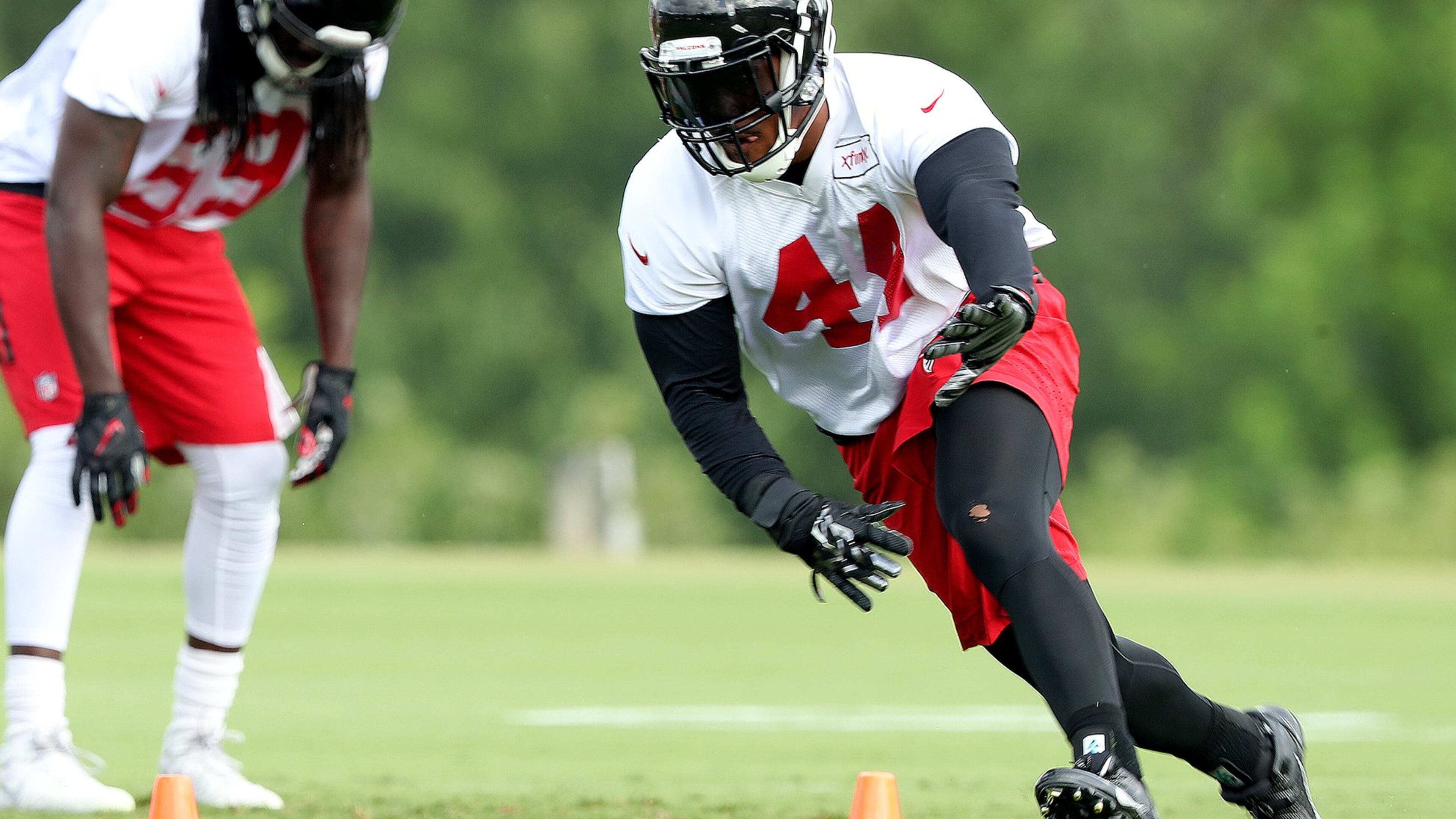Falcons Vic Beasley Jr. runs a drill during training camp on Friday, July 29, 2016, in Flowery Branch. Curtis Compton /ccompton@ajc.com