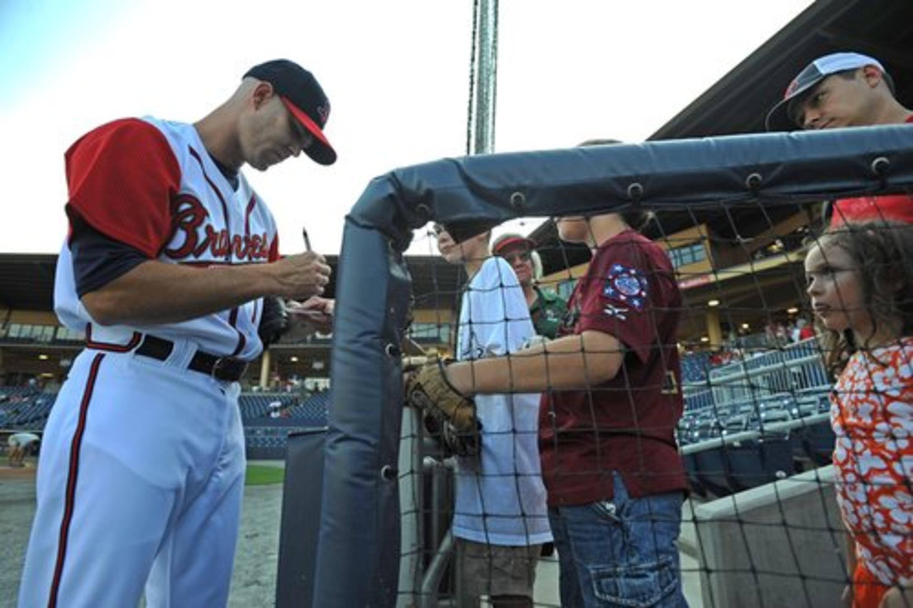 Tim Hudson signs for fans before the game Monday against the Lehigh Valley Ironpigs. Hudson's next rehab appearance could come either Friday or Saturday. Gwinnett is at home against Rochester on Friday and in Columbus on Saturday.