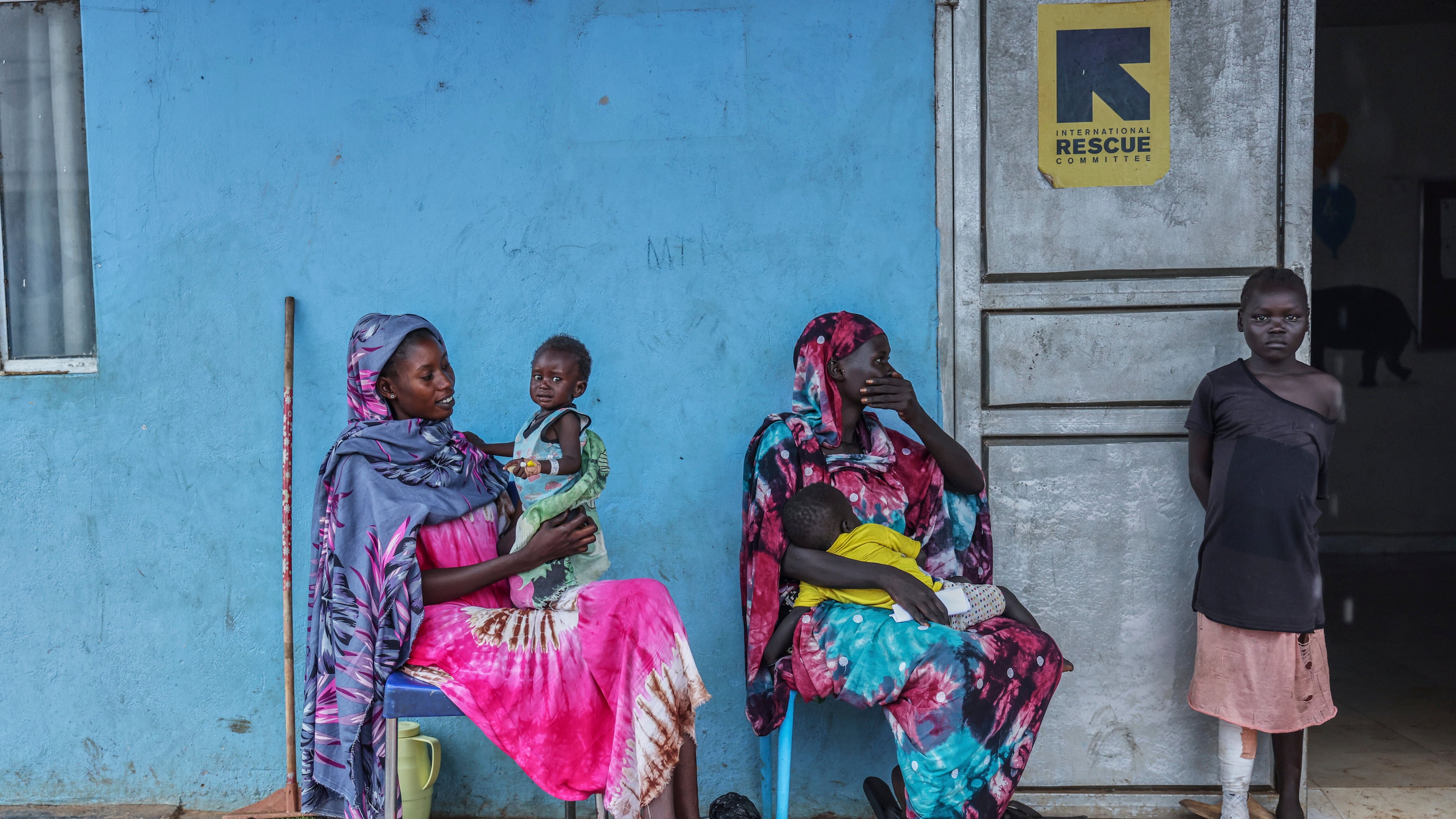 Patients sit outside the malnutrition ward of Bunj Hospital in Maban, South Sudan, Aug. 19, 2025. (AP Photo/Caitlin Kelly, File)