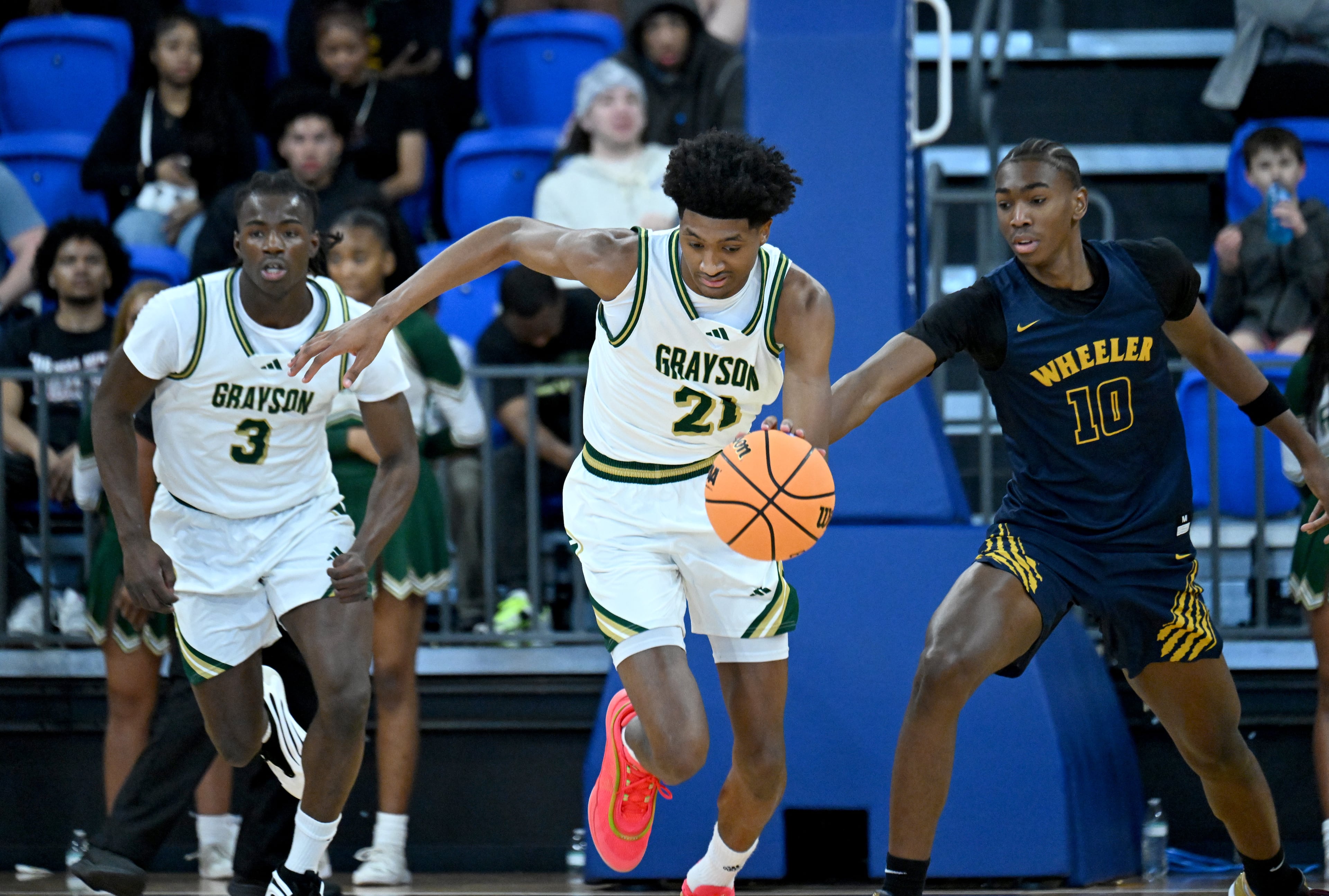 Grayson's Jacob Wilkins (21) brings the ball upcourt during the first half of the GHSA Class 6A Boys State Basketball playoffs game at the Georgia State Convocation Center, Saturday, March 1, 2025, in Atlanta. Wheeler won 68-53 over Grayson. (Hyosub Shin / AJC)