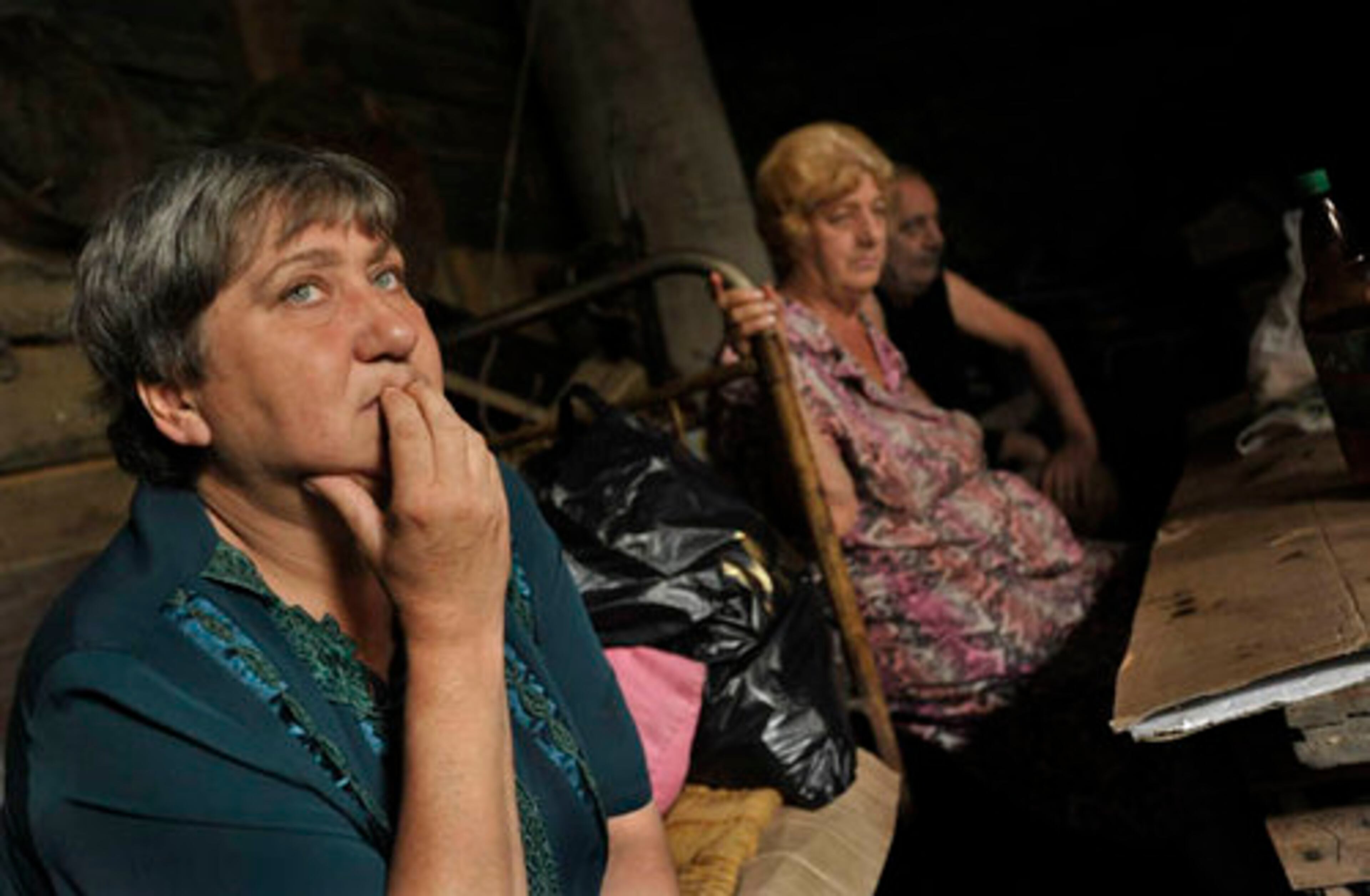 Georgians find shelter in a basement in the city of Gori, Georgia, Tuesday. Tens of thousands of terrified residents have fled the fighting -- South Ossetians north to Russia, and Georgians west toward the capital of Tbilisi and the country's Black Sea coast.