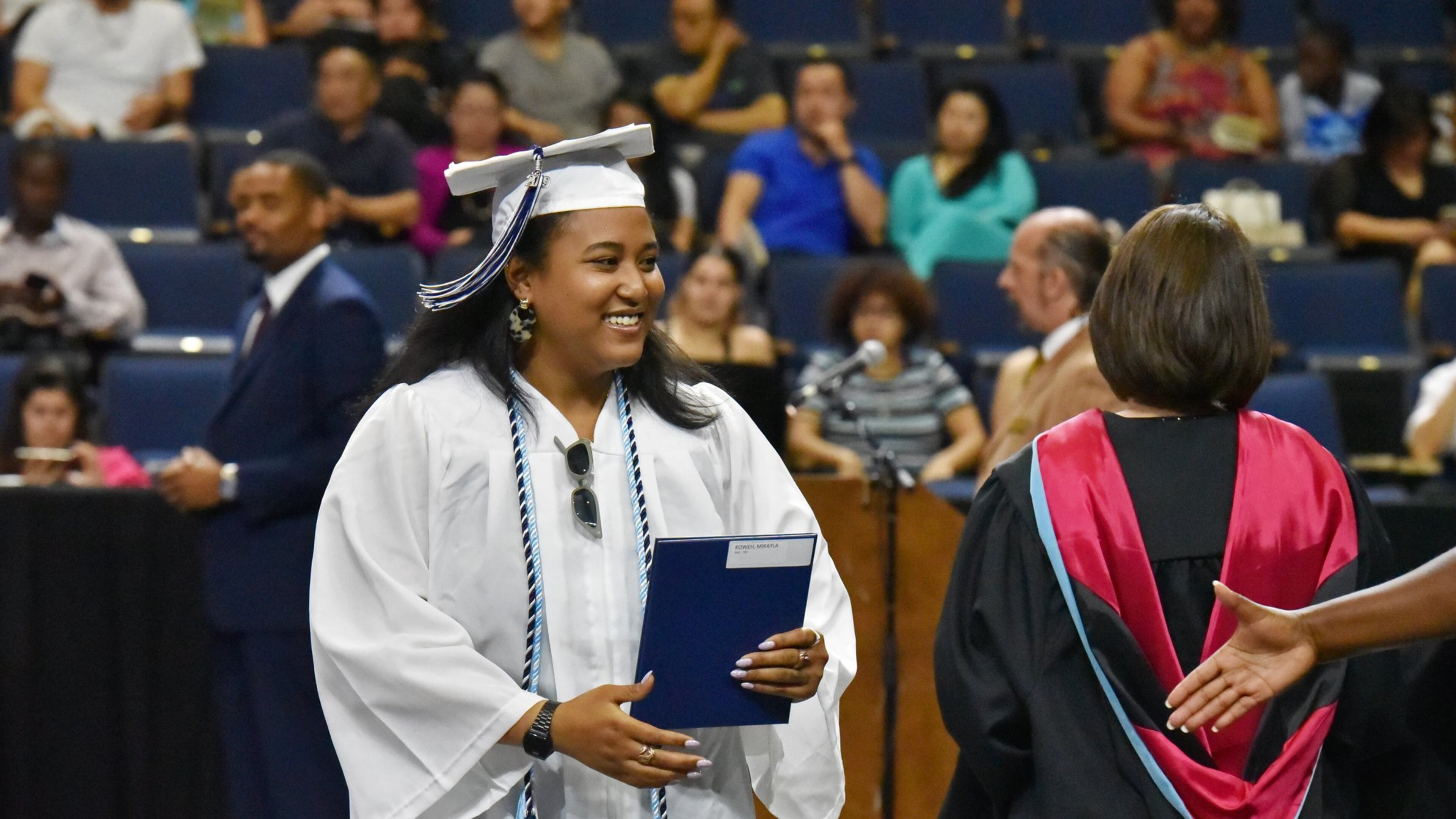 Mikayla Koweh, graduate from Norcross High School, smiles after she received her diploma during 2019 Gwinnett County Public Schools summer school graduation at Infinite Energy Arena on Wednesday, July 3, 2019. HYOSUB SHIN / HYOSUB.SHIN@AJC.COM