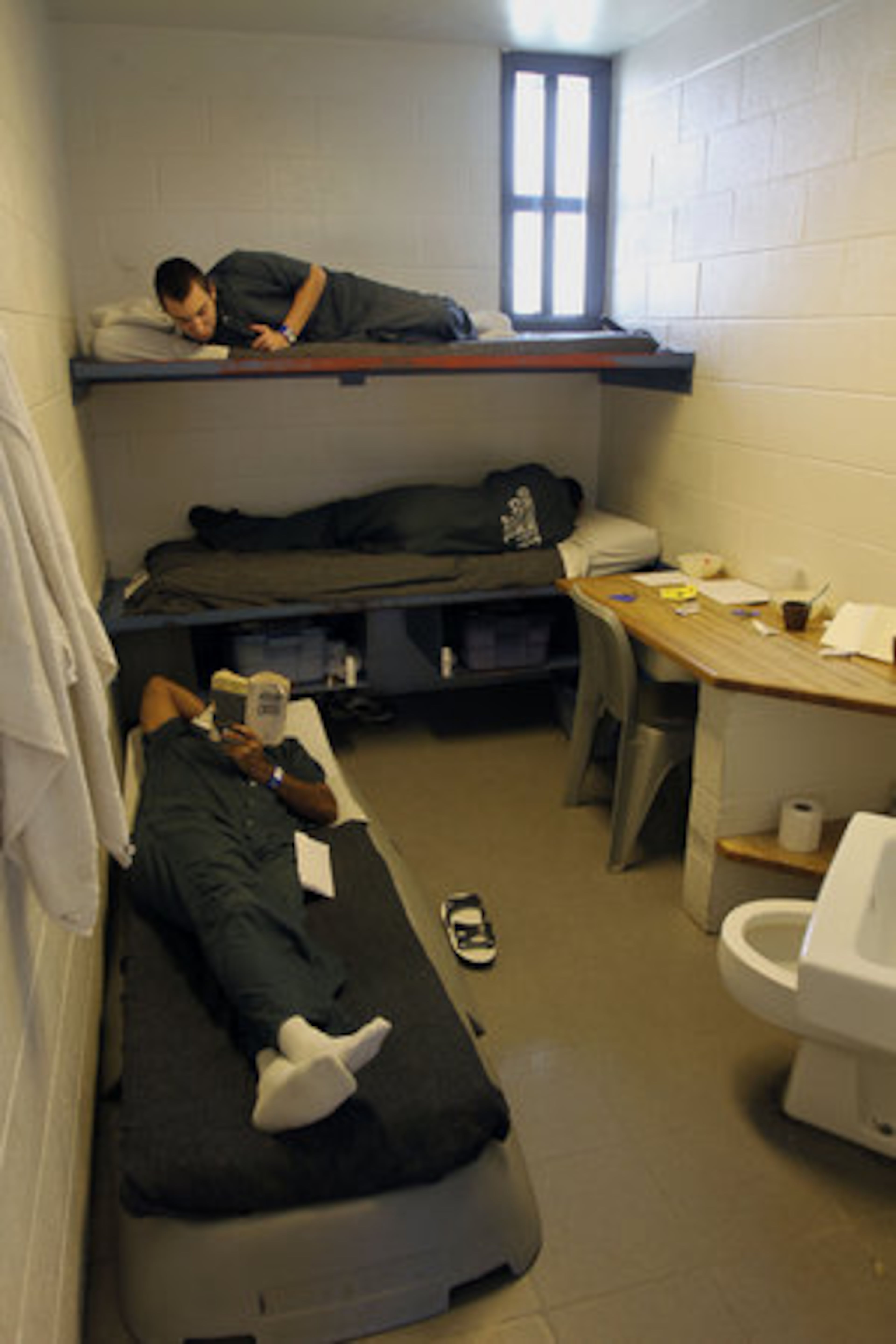 These inmates are housed in a cell with three bunk beds at the Gwinnett County Detention Center, but about 400 others are sleeping on the floor.
