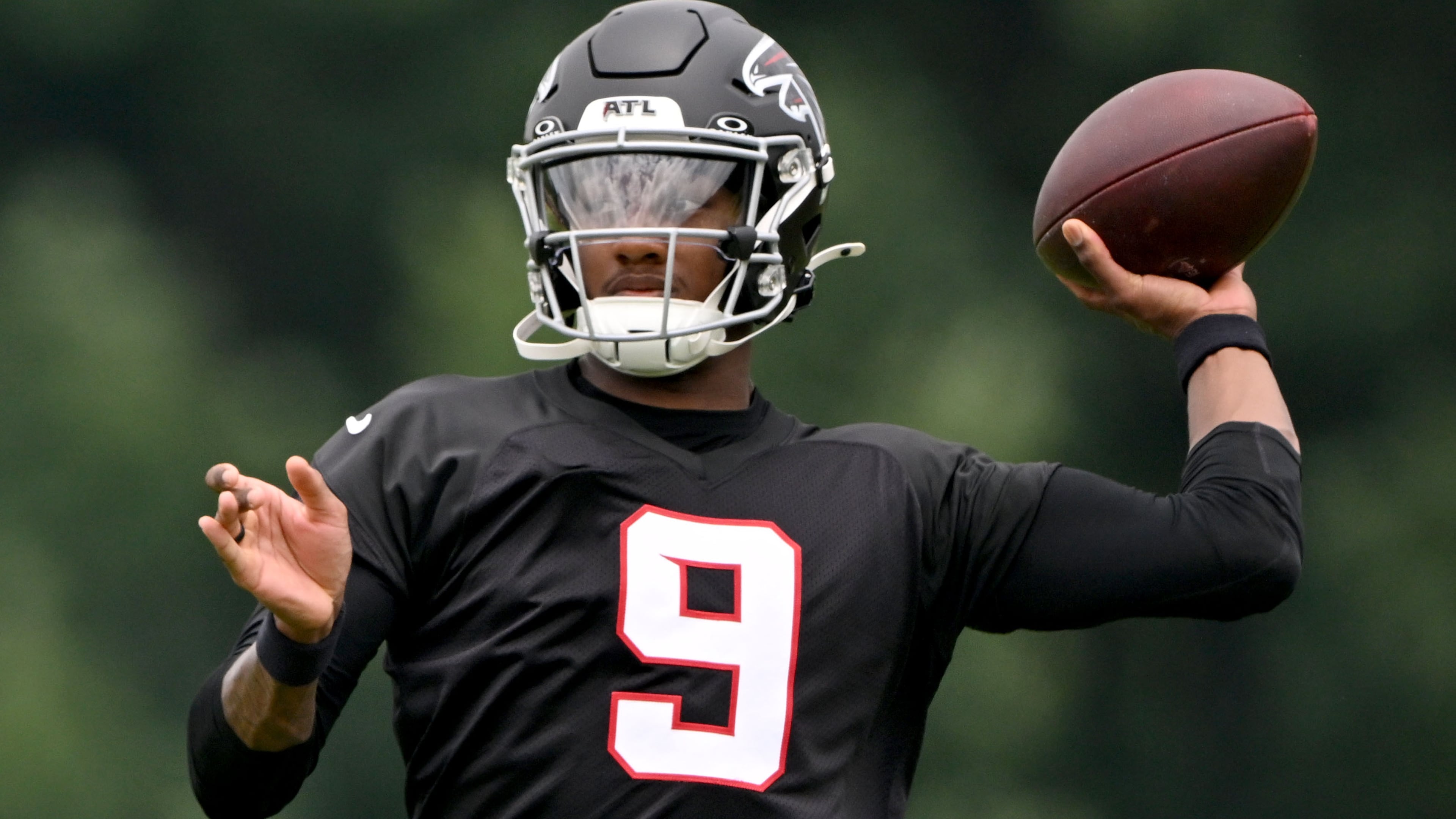 Falcons quarterback Michael Penix Jr. runs a drill during an OTA workout at the team's traning facility on Wednesday, May 27, 2026, in Flowery Branch. (Hyosub Shin/AJC)