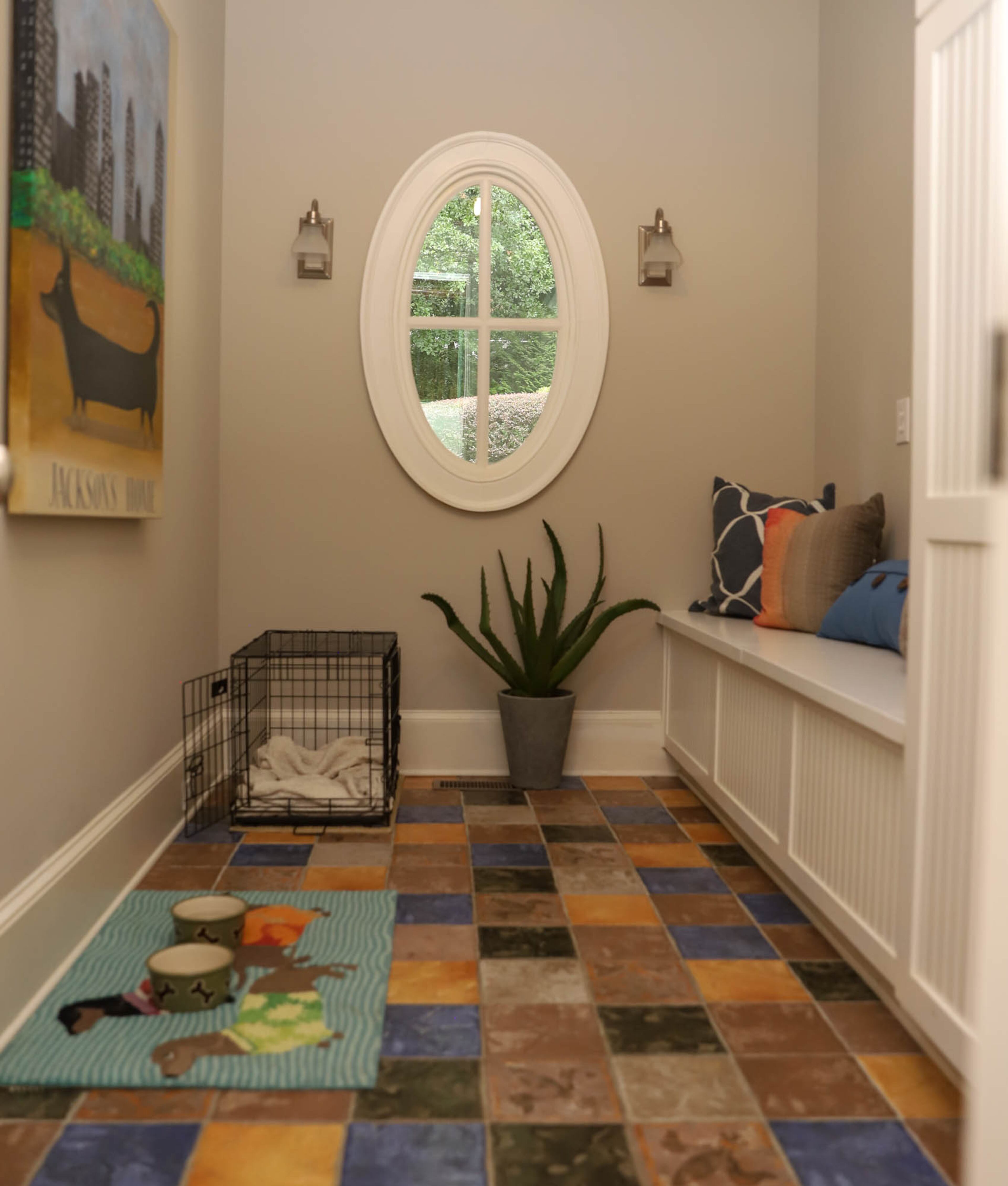 The mudroom of Jason Warshaw and David Diehl's home is dedicated to their dachshund mix, Jackson. The Italian tile makes the room a bit whimsical and easy to clean. The room's theme is completed by a custom painting of Jackson, painted by Diehl's father.