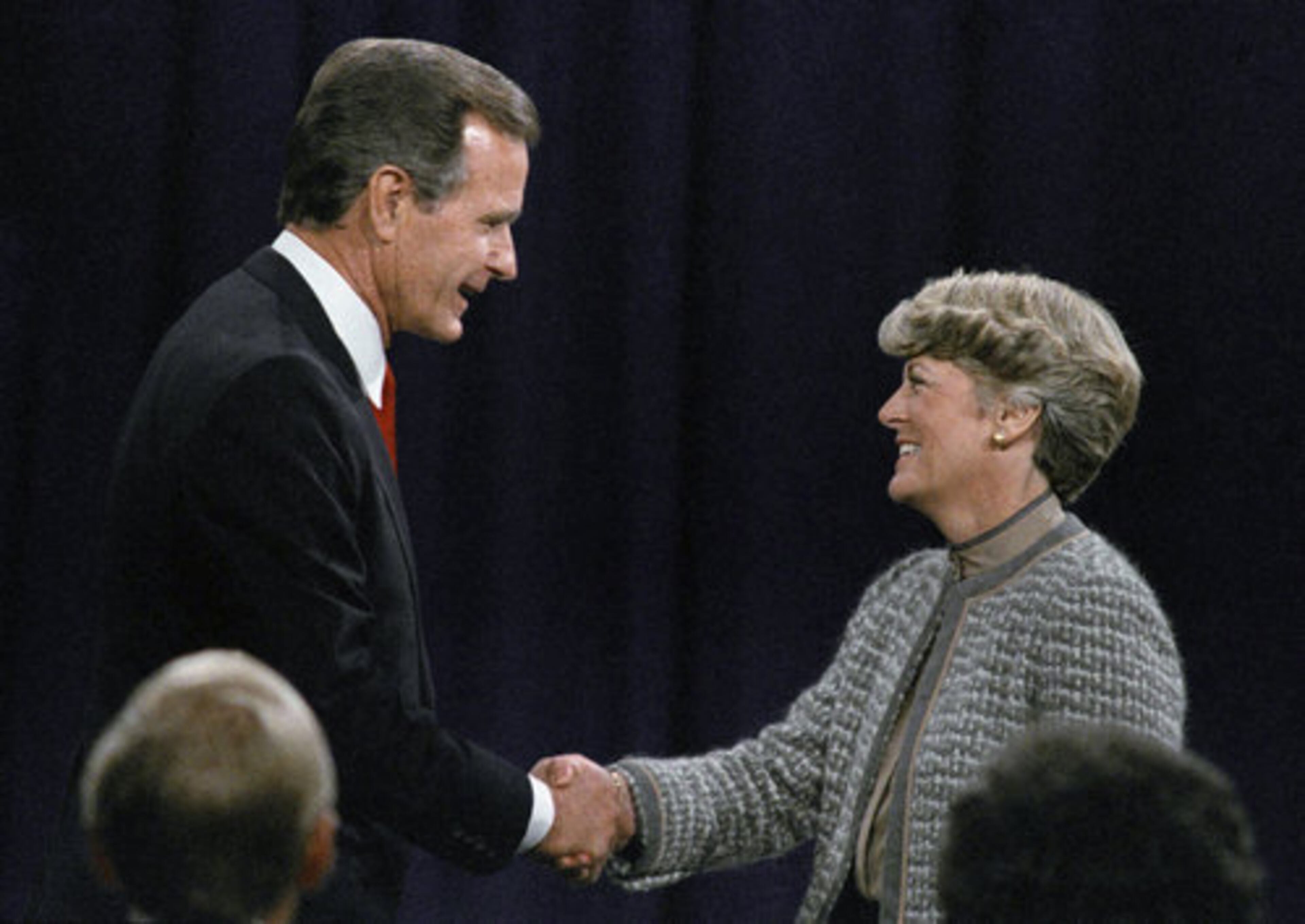 In this Oct. 11, 1984, photo Vice-President George H. Bush shakes hands with Democratic vice-presidential candidate Geraldine Ferraro before their debate in Philadelphia.