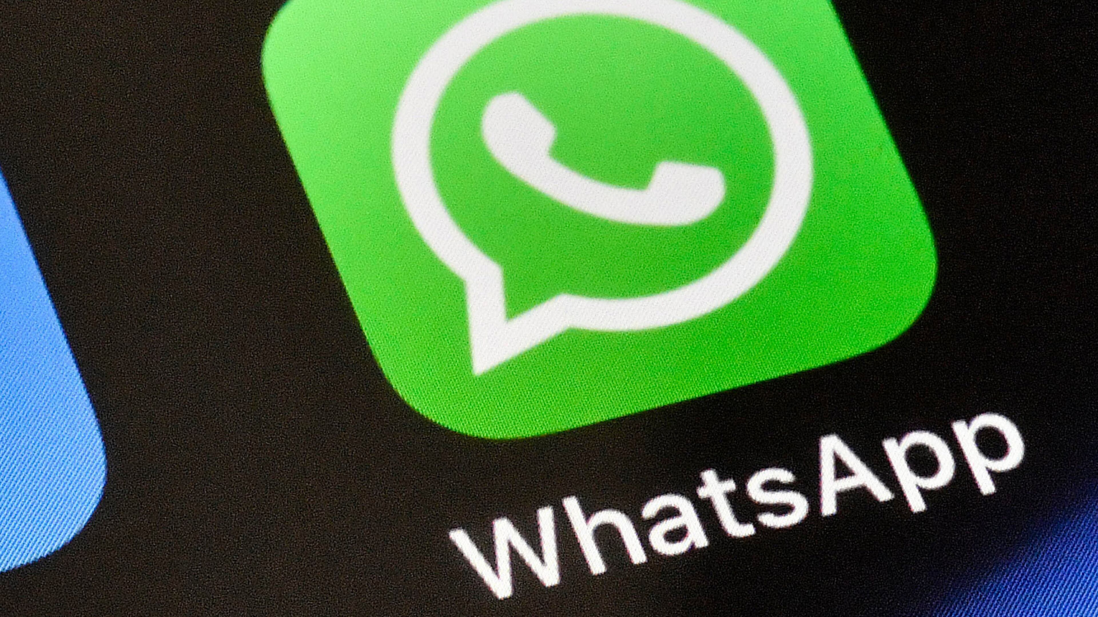 FILE - A WhatsApp icon is displayed on an iPhone, Nov. 15, 2018, in Gelsenkirchen, Germany. (AP Photo/Martin Meissner, File)