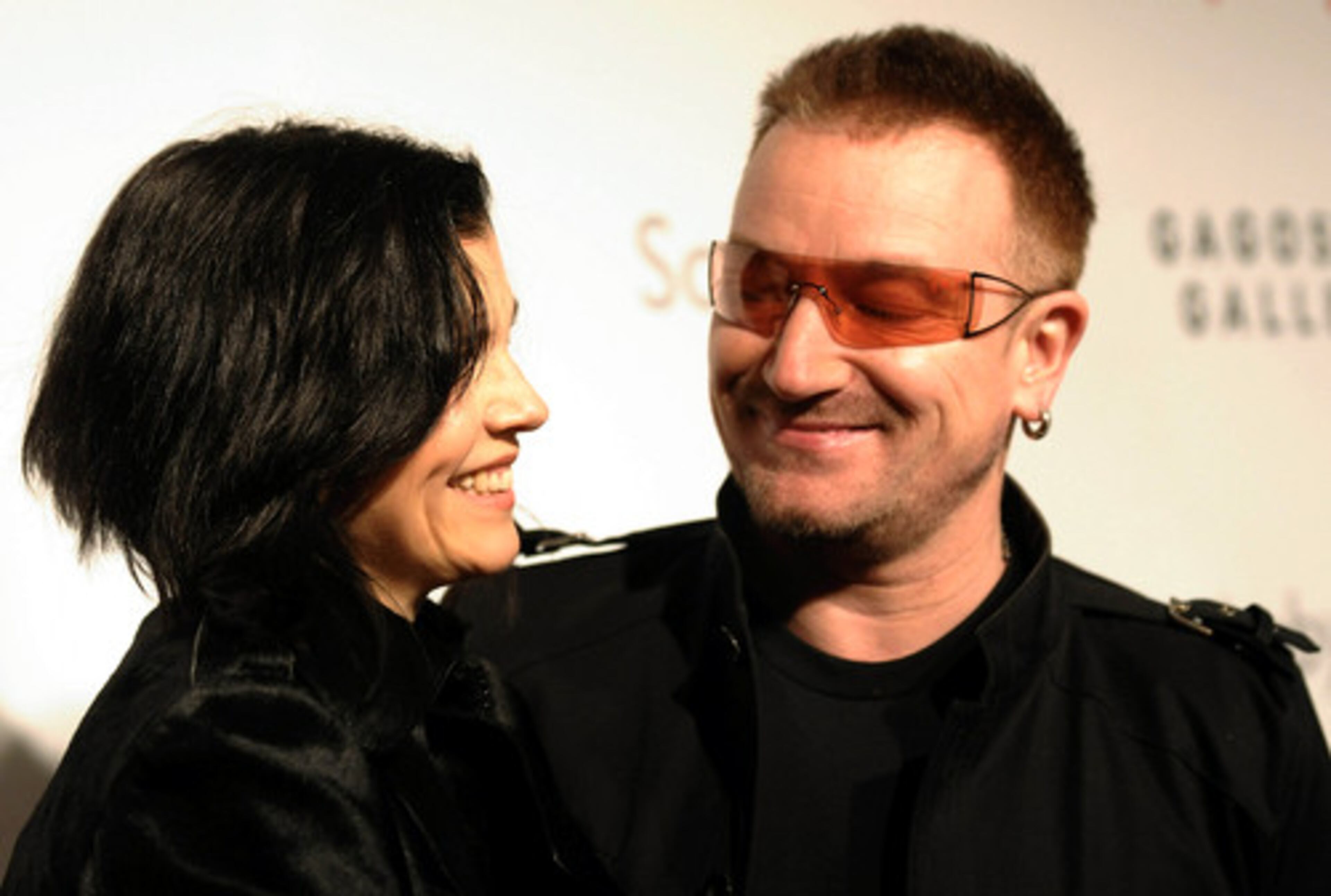 The (Red) Auction on Valentine's Day raised more than $42.5 million to benefit HIV/AIDS relief programs in Africa. U2 frontman Bono, who helped organize the event, gets close to his wife, Ali Hewson.