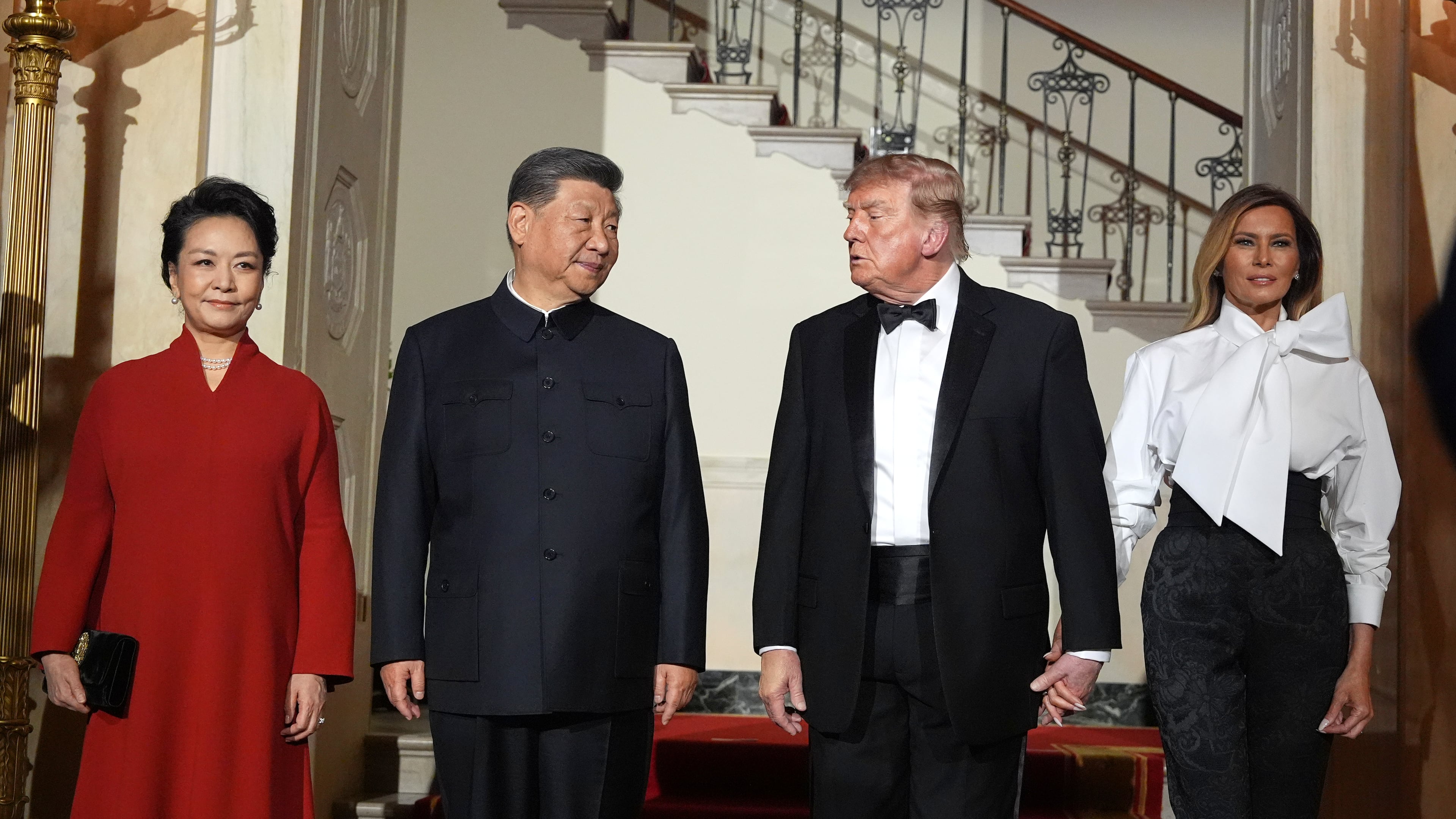 President Donald Trump and first lady Melania Trump pose for a photo with China's President Xi Jinping and his wife Peng Liyuan in the Grand Foyer of the White House during a State Dinner, Thursday, Sept. 24, 2026, in Washington. (AP Photo/Alex Brandon)