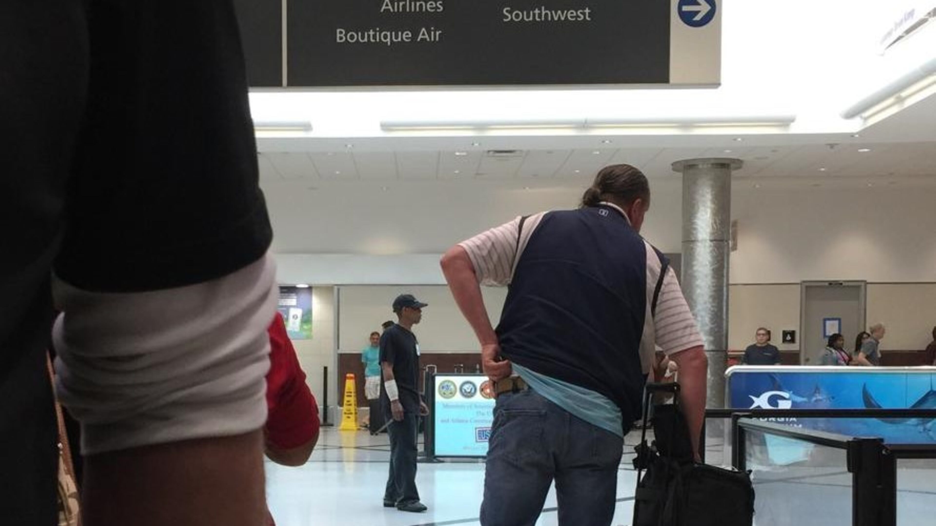 A witness provided this photo to AJC.com. Atlanta police confirmed the man, who appears to be holding a knife, is the suspect who was taken into custody.