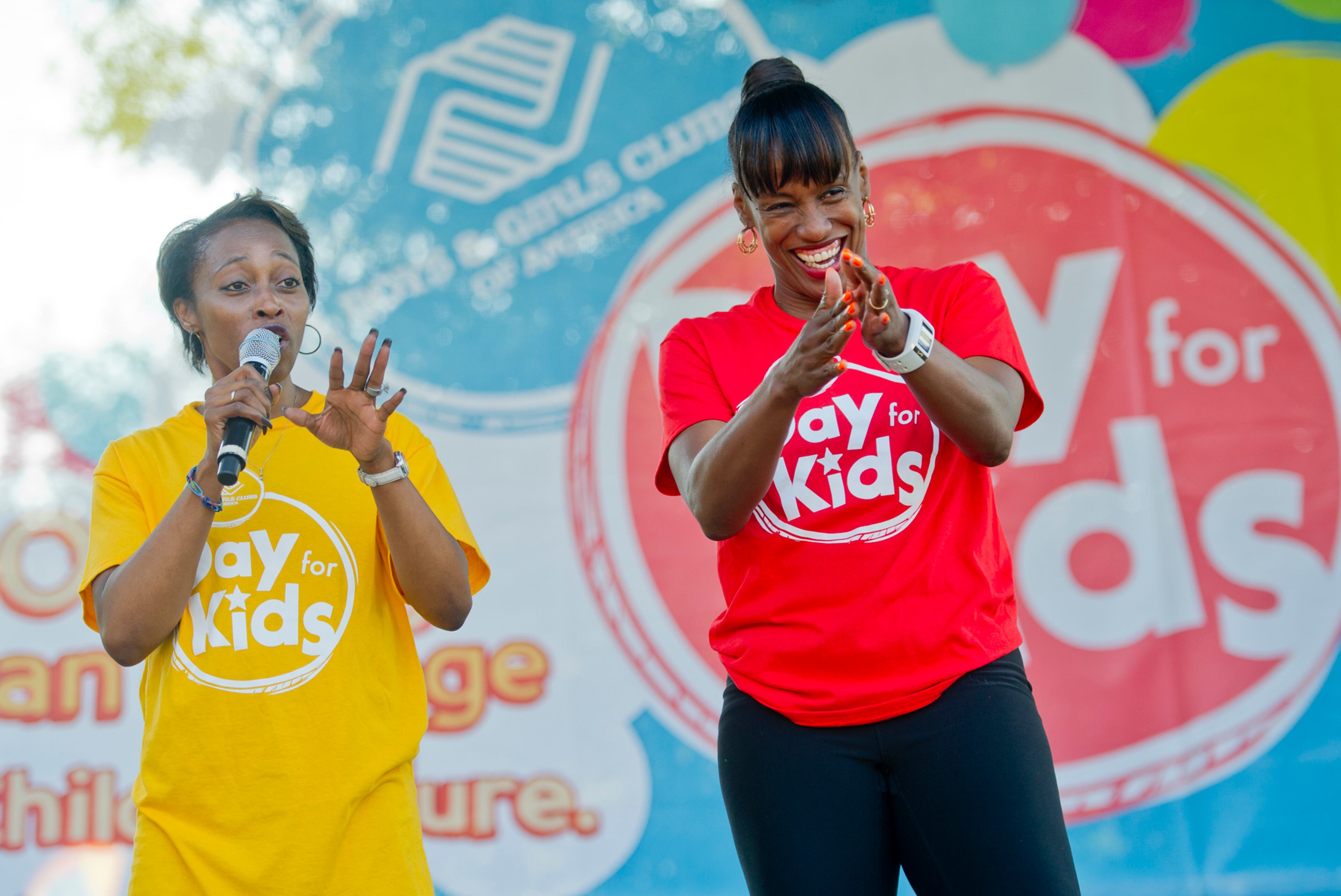 Gail Devers (left) and Jackie Joyner-Kersee take the stage during the Boys & Girls Clubs of America's Day for Kids at Piedmont Park in Atlanta on Saturday, September 7, 2013. Day for Kids is a national initiative to raise awareness for critical issues facing young men and women. With more than a decade of tradition, Day for Kids invites adults to act like kids again by participating in field day events such as relay races, dodge ball, tug of war and lots of other activities. JONATHAN PHILLIPS / SPECIAL