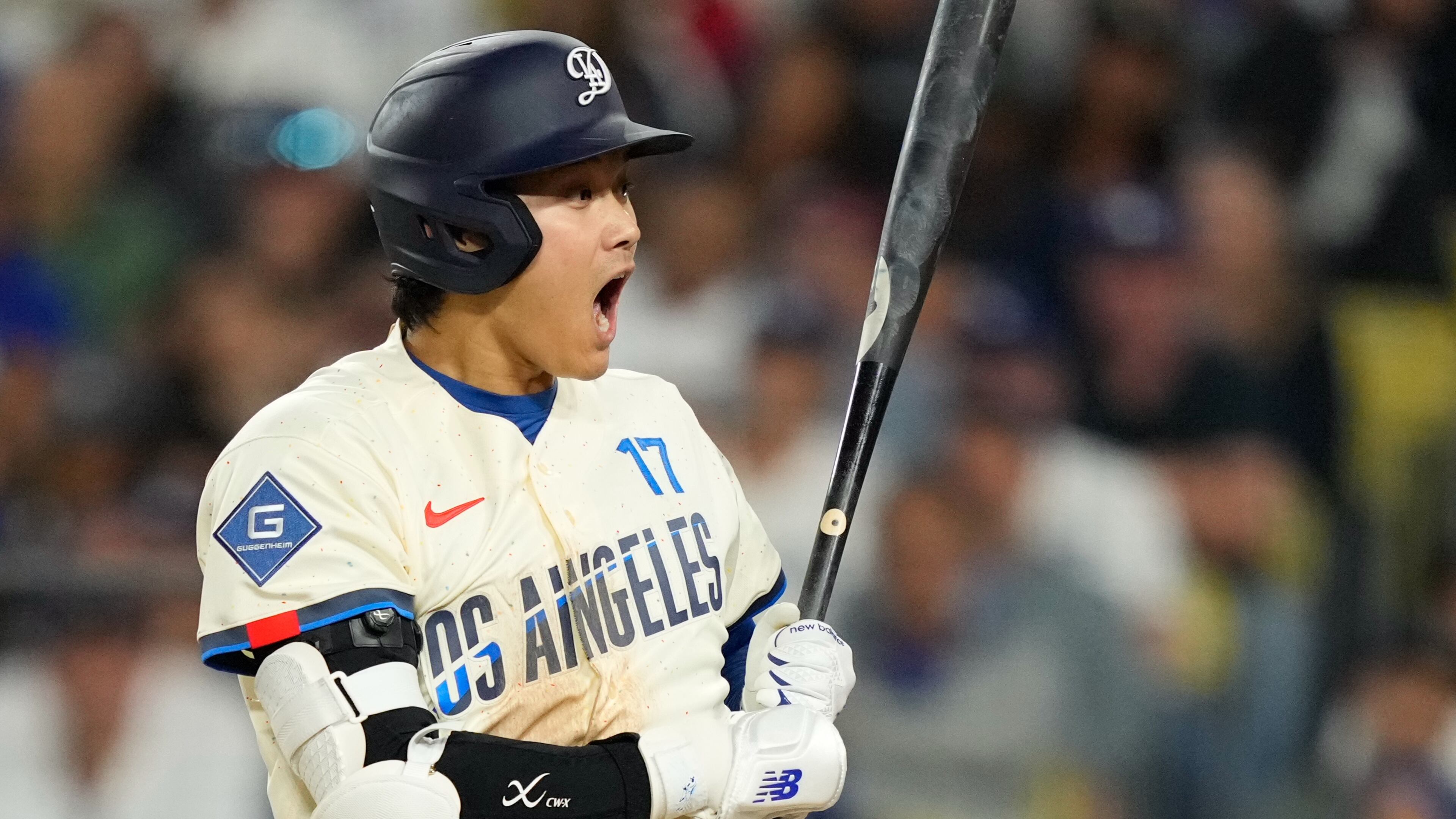 Los Angeles Dodgers' Shohei Ohtani reacts after a pitch was thrown in the dirt during the seventh inning of a baseball game against the Philadelphia Phillies, Saturday, May 30, 2026, in Los Angeles. (AP Photo/Mark J. Terrill)