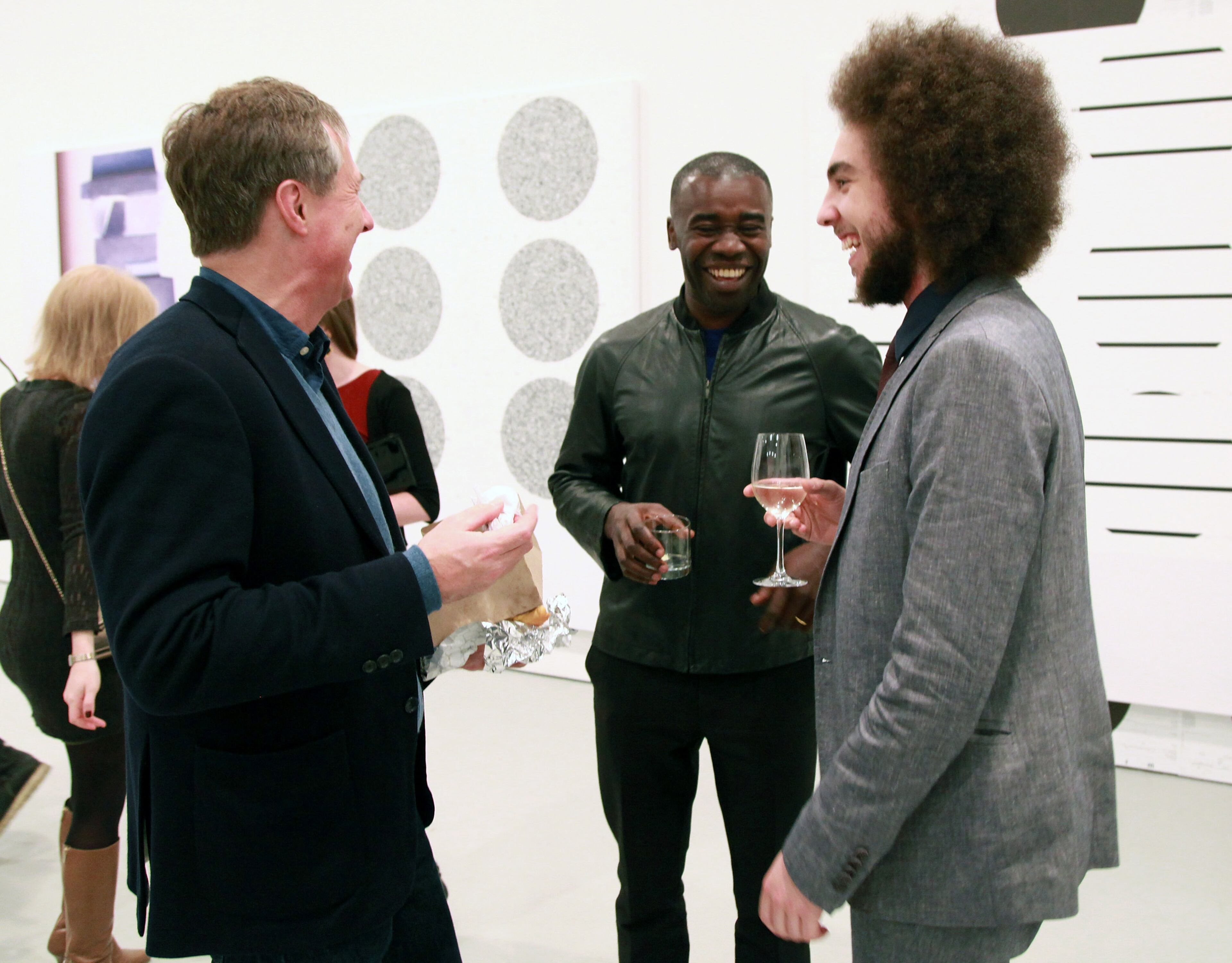 NEW YORK, NY - FEBRUARY 16: Gallerist David Zwirner, Time honoree painter Chris Ofili, and Moses Mawila attend the Michael Riedel Art Exhibition: Powerpoint at David Zwirner Gallery on February 16, 2013 in New York, United States. (Photo by Taylor Hill/Getty Images)