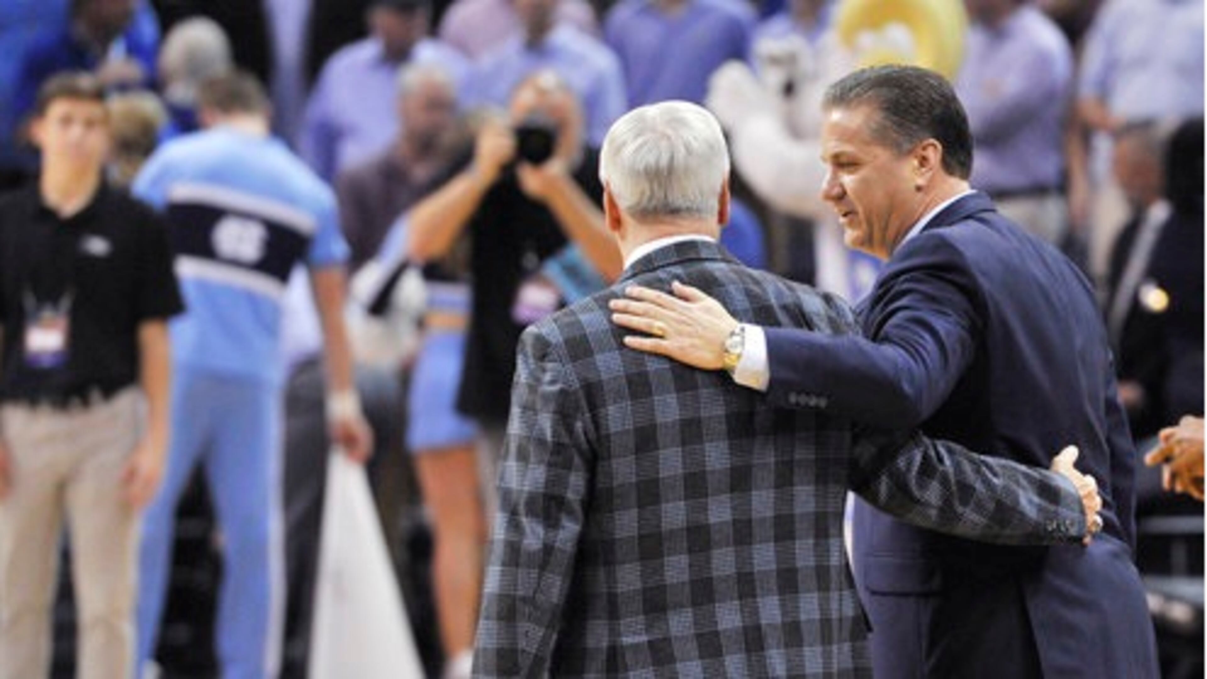 Kentucky head coach John Calipari, right, and Kentucky head coach John Calipari speak before the first half of the South Regional final game in the NCAA college basketball tournament, Sunday, March 26, 2017, in Memphis, Tenn.(AP Photo/Brandon Dill)