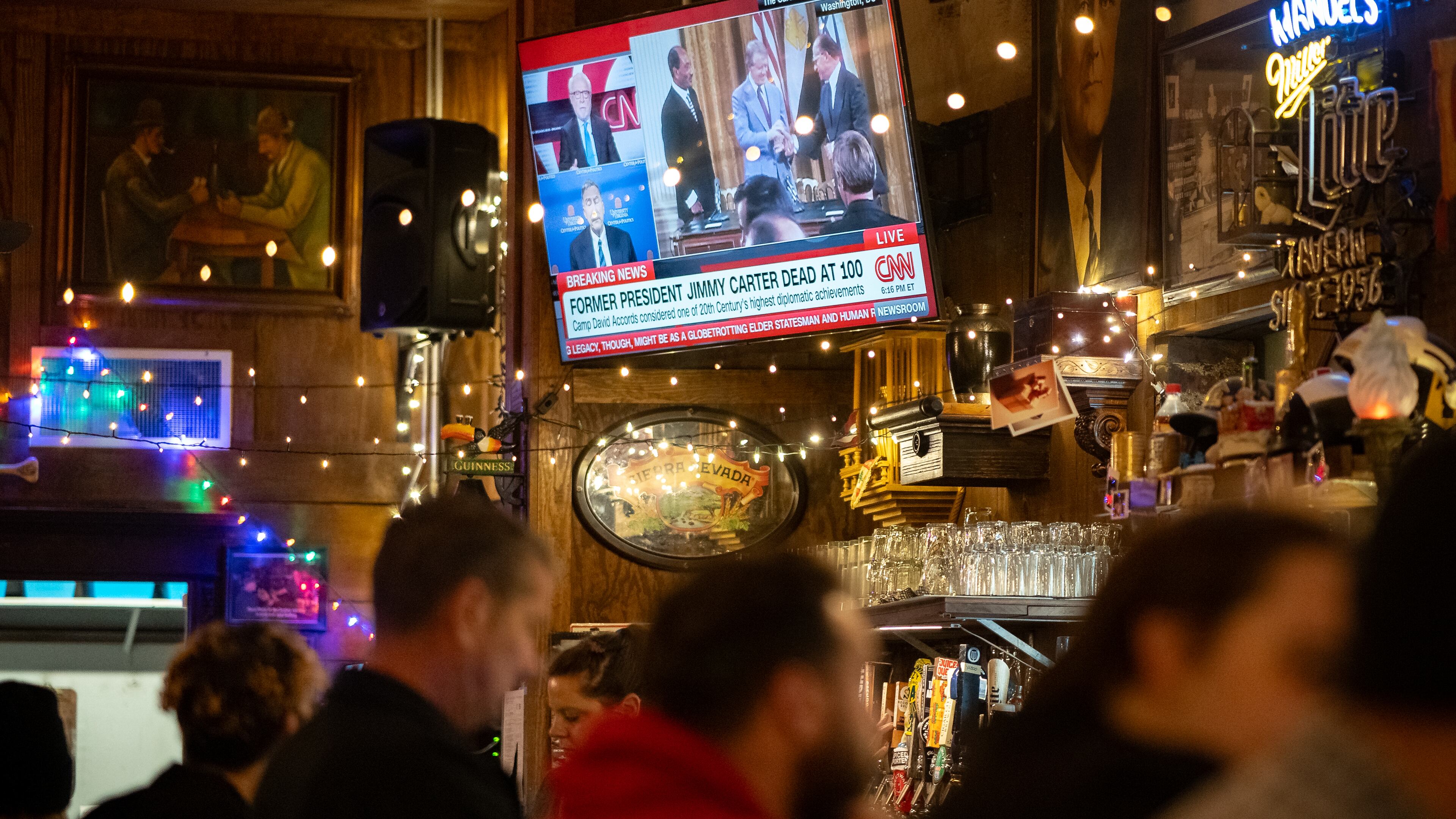 Atlanta residents react to President Jimmy Carter's death at Manuel's Tavern in Atlanta,Georgia. Sunday, December 29,2024 (Ben Hendren for the Atlanta Journal-Constitution)