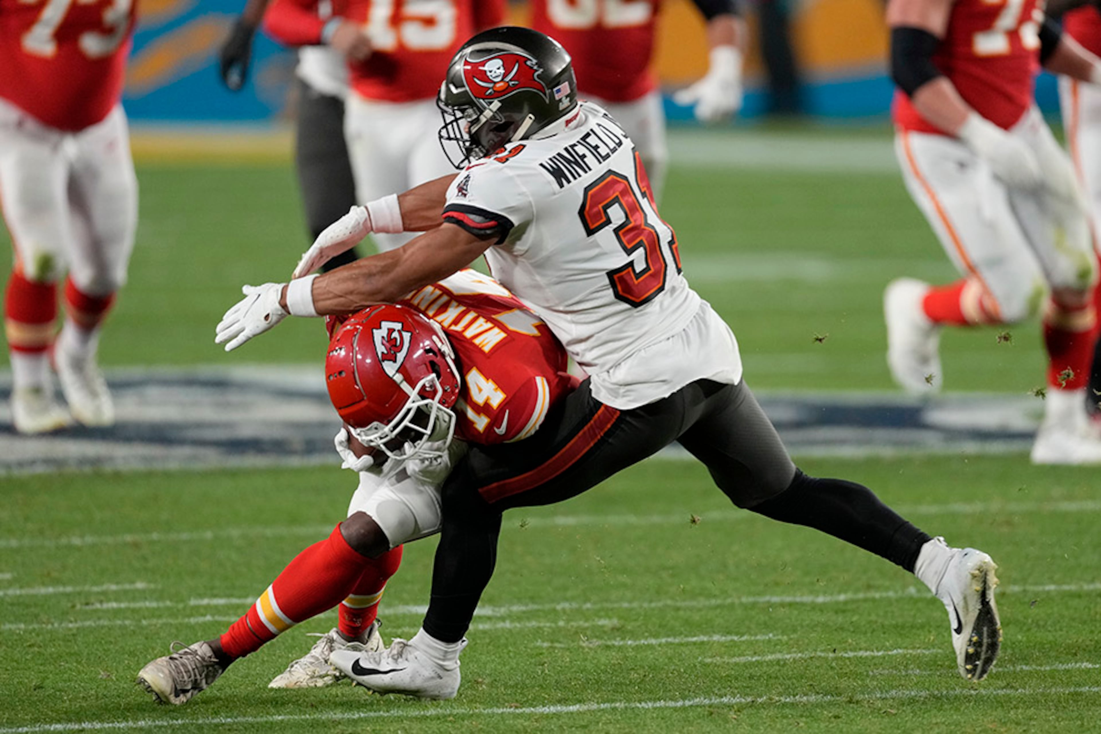 Kansas City Chiefs wide receiver Sammy Watkins (14) is tackled by Tampa Bay Buccaneers' Antoine Winfield Jr. after catching a pass during the second half of Super Bowl 55 Sunday, Feb. 7, 2021, in Tampa, Fla. (Chris O'Meara/AP)