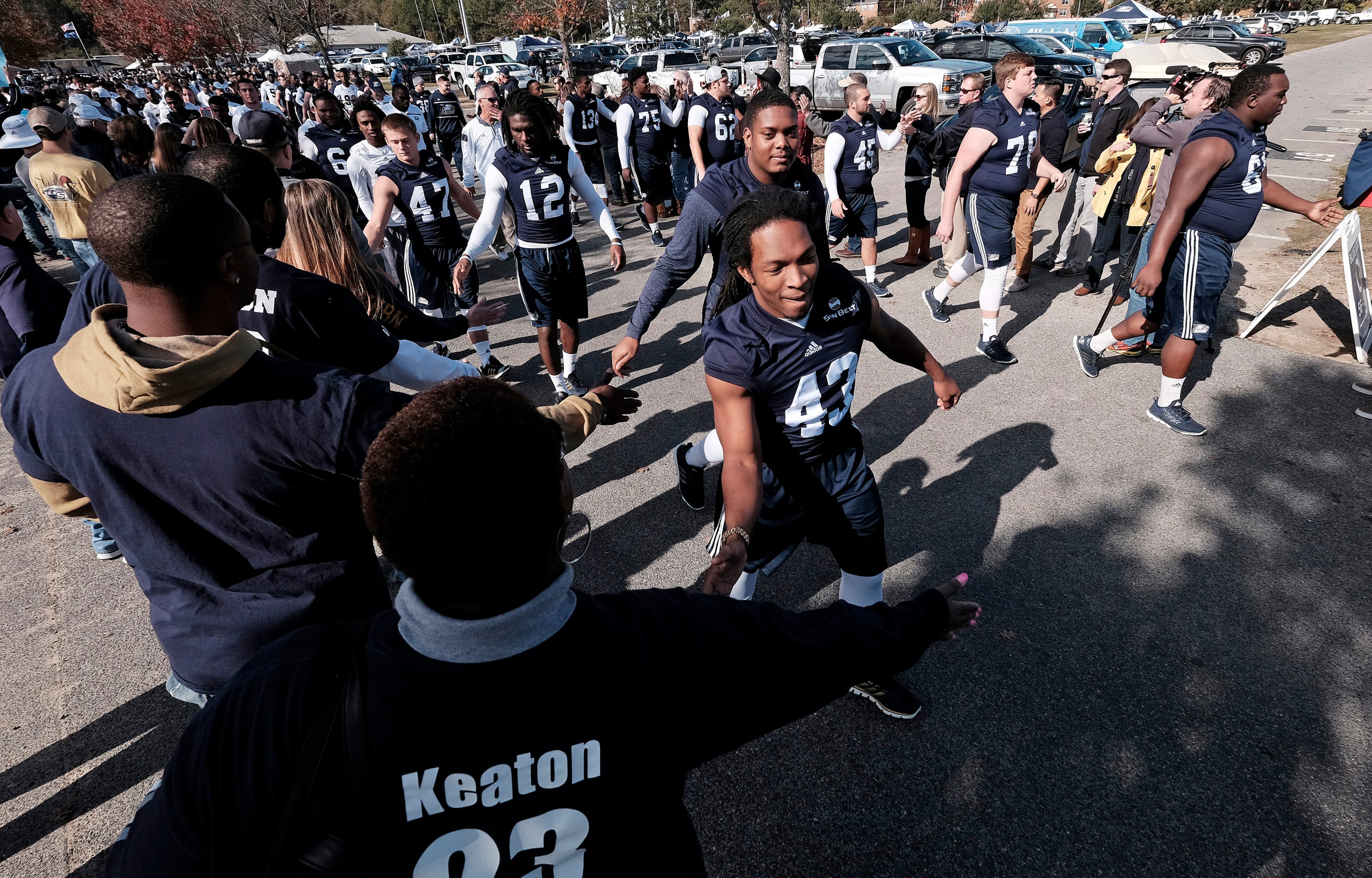 STATESBORO, GA - DECEMBER 5: Players for the Georgia Southern Eagles greet fans during the Eagle Walk before their game against the Georgia State Panthers on December 5, 2015 at Paulson Stadium in Statesboro, Georgia. (Photo by Todd Bennett/Getty Images)