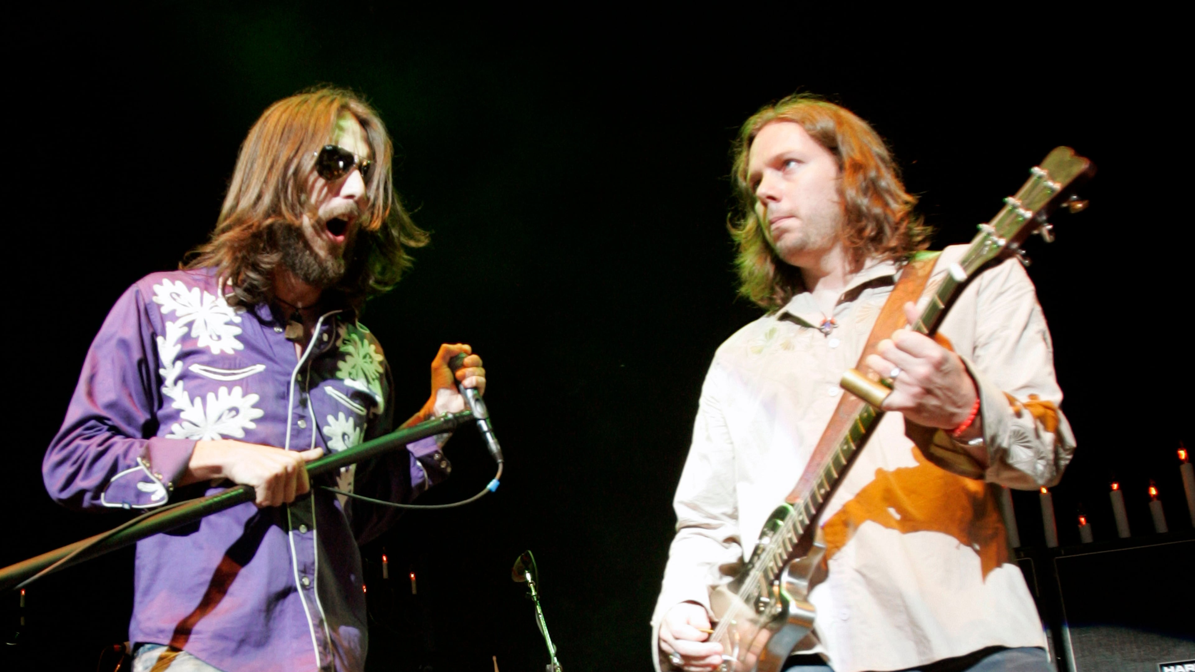 Vocalist Chris Robinson, left, and guitarist Rich Robinson of The Black Crowes perform with the band as the opening act for Tom Petty and the Heartbreakers at the Tweeter Center in Mansfield, Mass., on Saturday, June 18, 2005. (AP Photo/Robert E. Klein) Chris and Rich Robinson in more harmonious times in 2005. Photo: AP