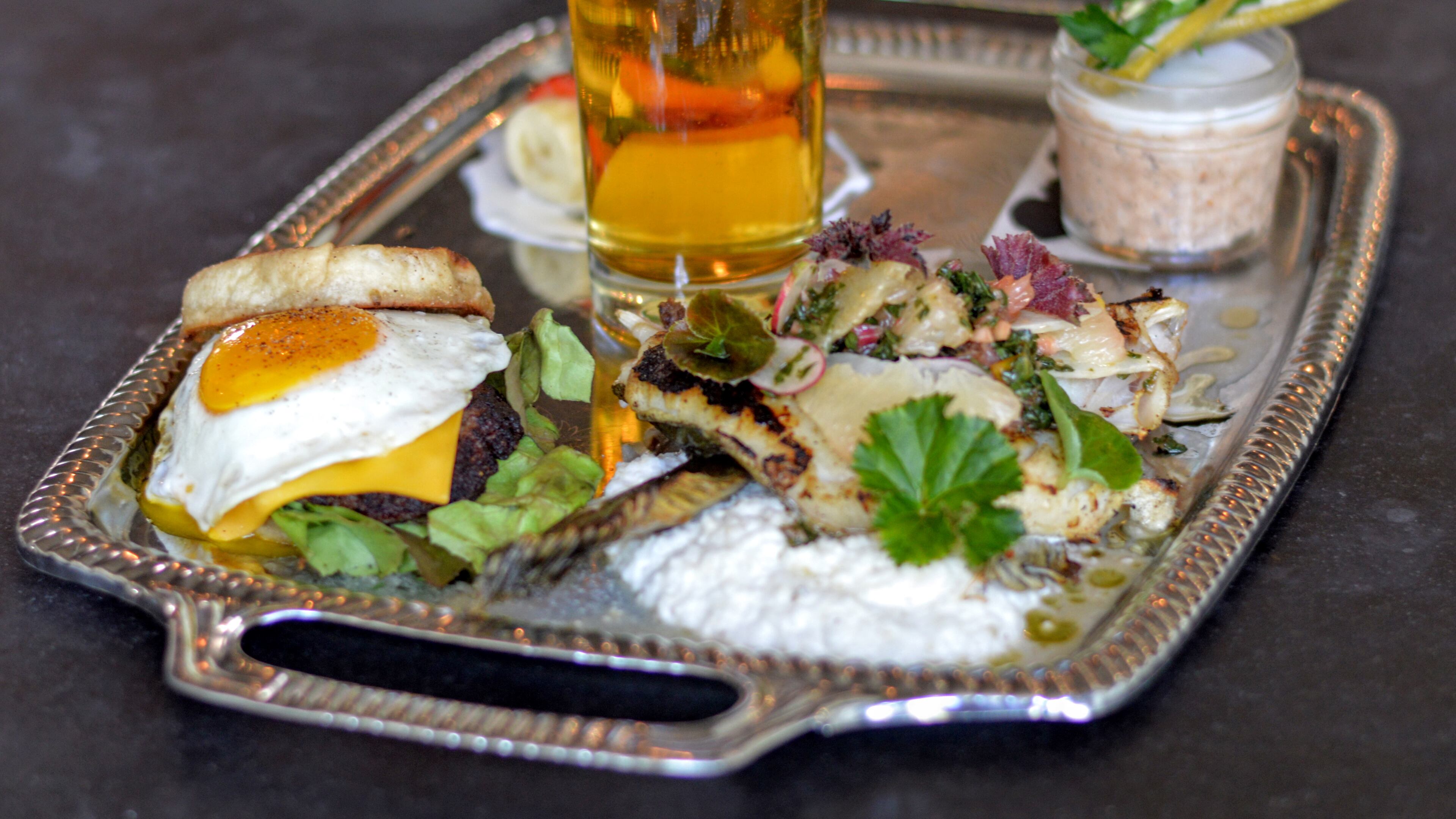 The Chef's Breakfast at One-Eared Stag is an ever-changing brunch menu item -- but it always comes with a beer. One Eared Stag was name best farm-to-table restaurant in Georgia by Travel + Leisure. Photo by Henri Hollis