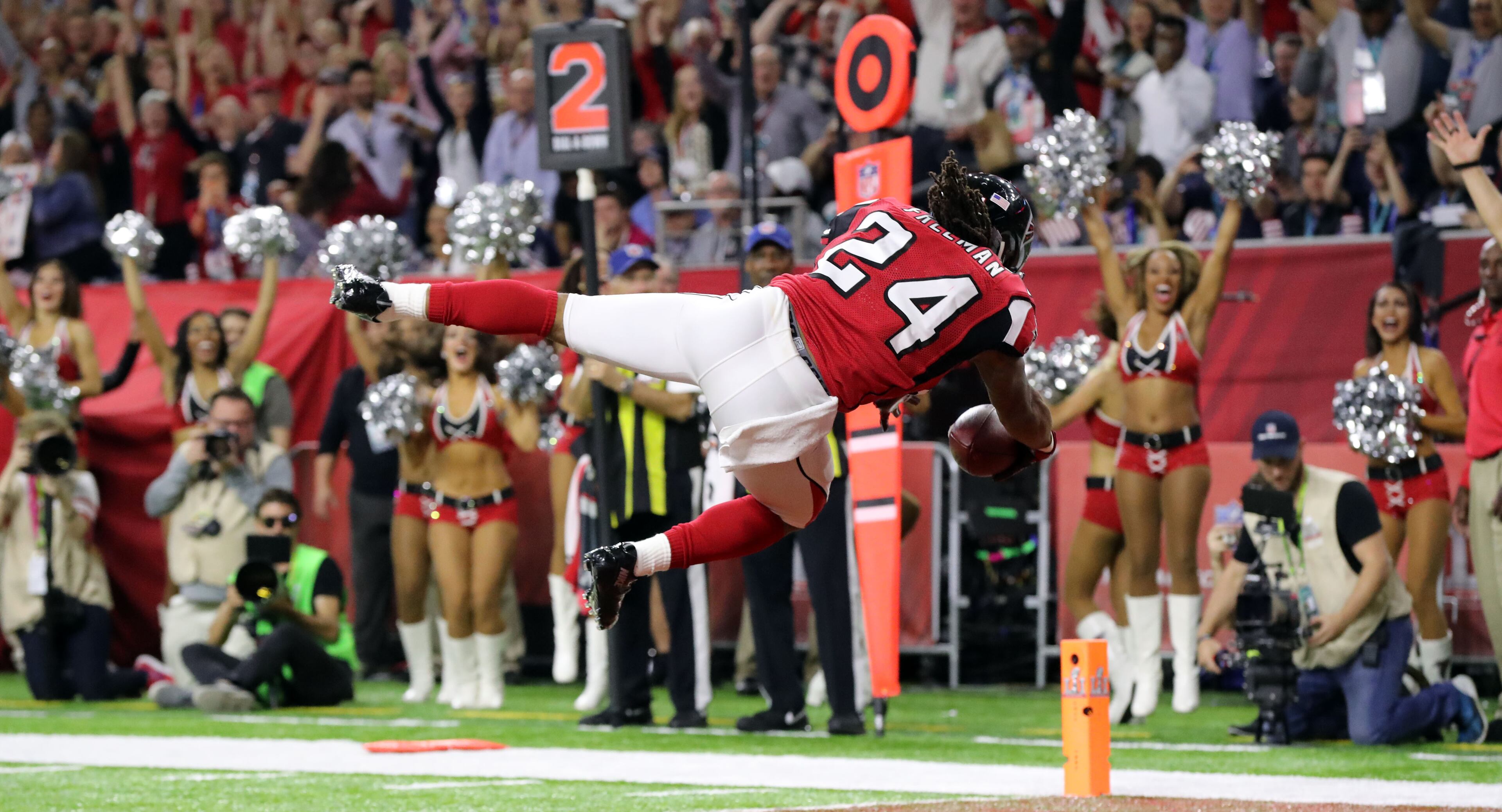 FEBRUARY 5, 2017 HOUSTON TX Atlanta Falcons running back Devonta Freeman (24) dives into the end zone for a score in the first quarter as the Atlanta Falcons meet the New England Patriots in Super Bowl LI at NRG Stadium in Houston, TX, Sunday, February 5, 2017. Curtis Compton/AJC