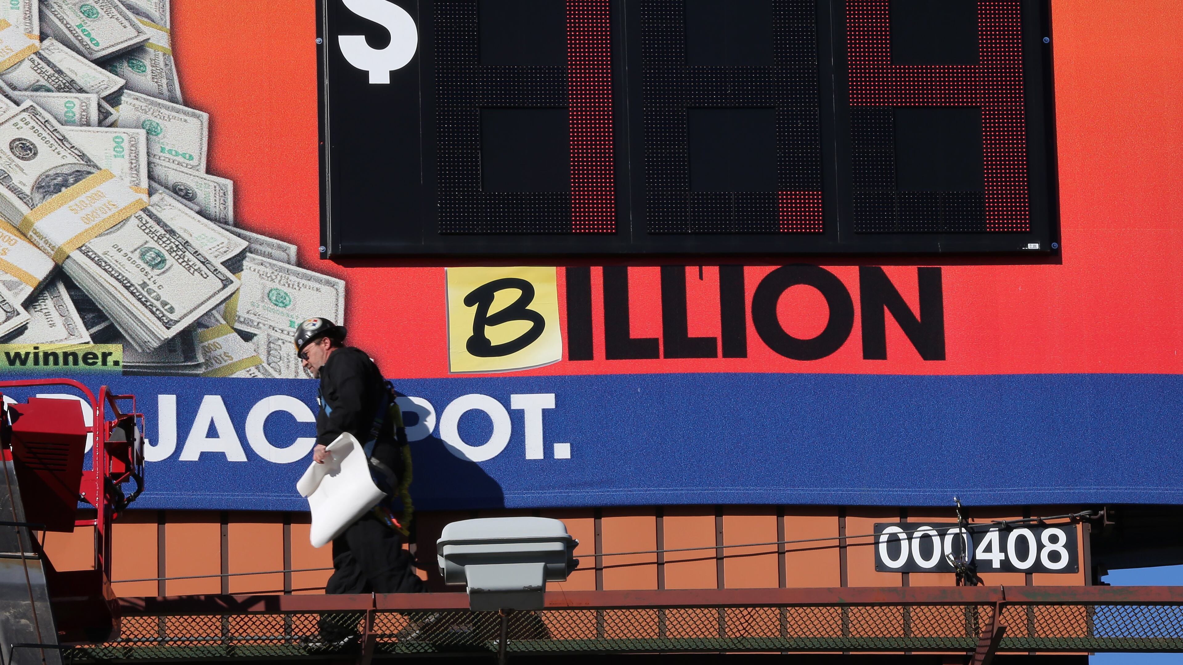 January 11, 2016, Atlanta: Tim Baldwin walks off after adding a "B" to a Georgia Lottery billboard near Turner Field on Monday afternoon January 11, 2016 to reflect the Powerball jackpot which has grown to $1.4 billion after nobody won Saturday night's drawing. Ben Gray / bgray@ajc.com