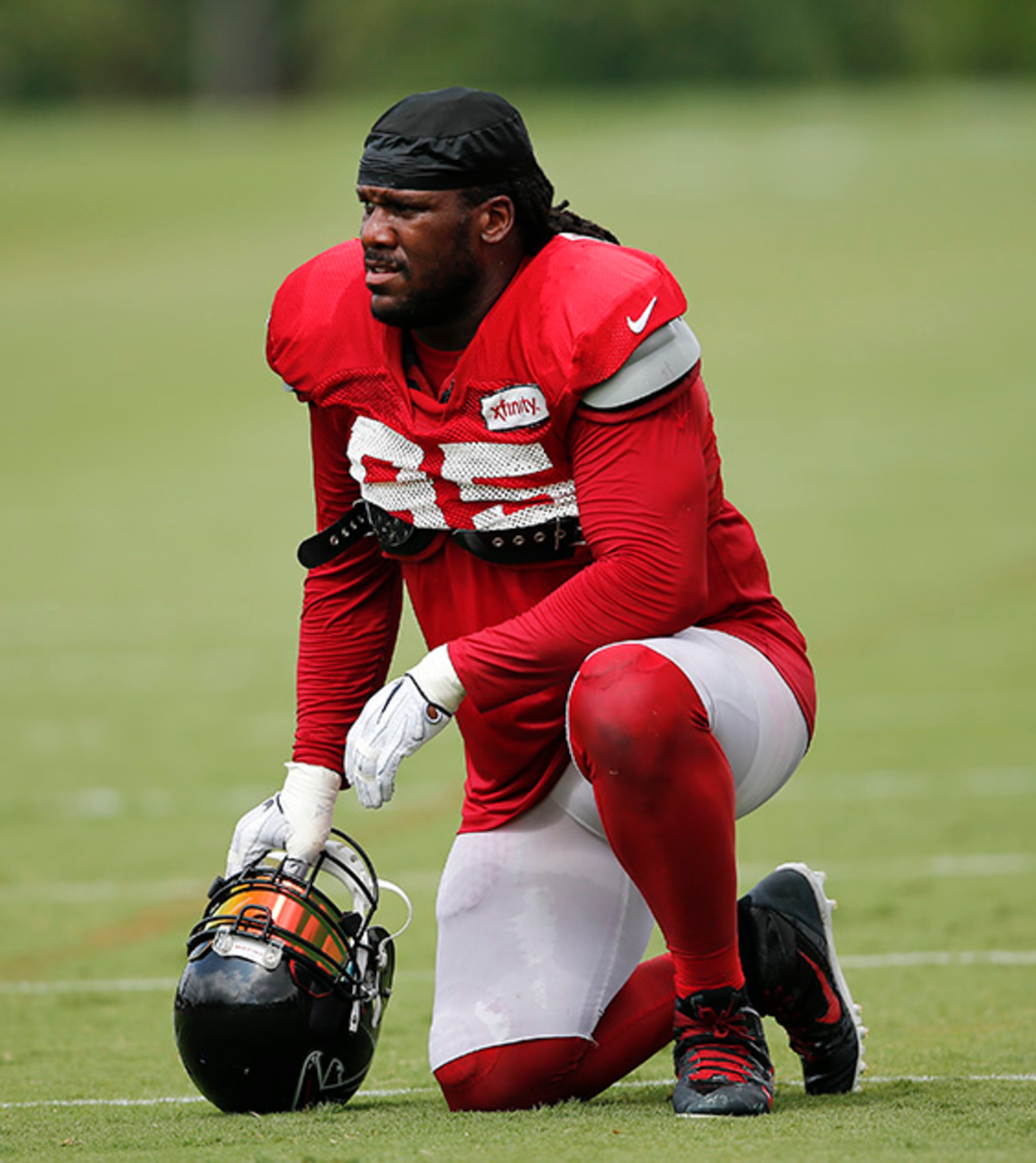 Atlanta Falcons nose tackle Jonathan Babineaux (95) looks on from the sideline during practice Thursday, Aug. 4, 2016, in Flowery Branch, Ga.