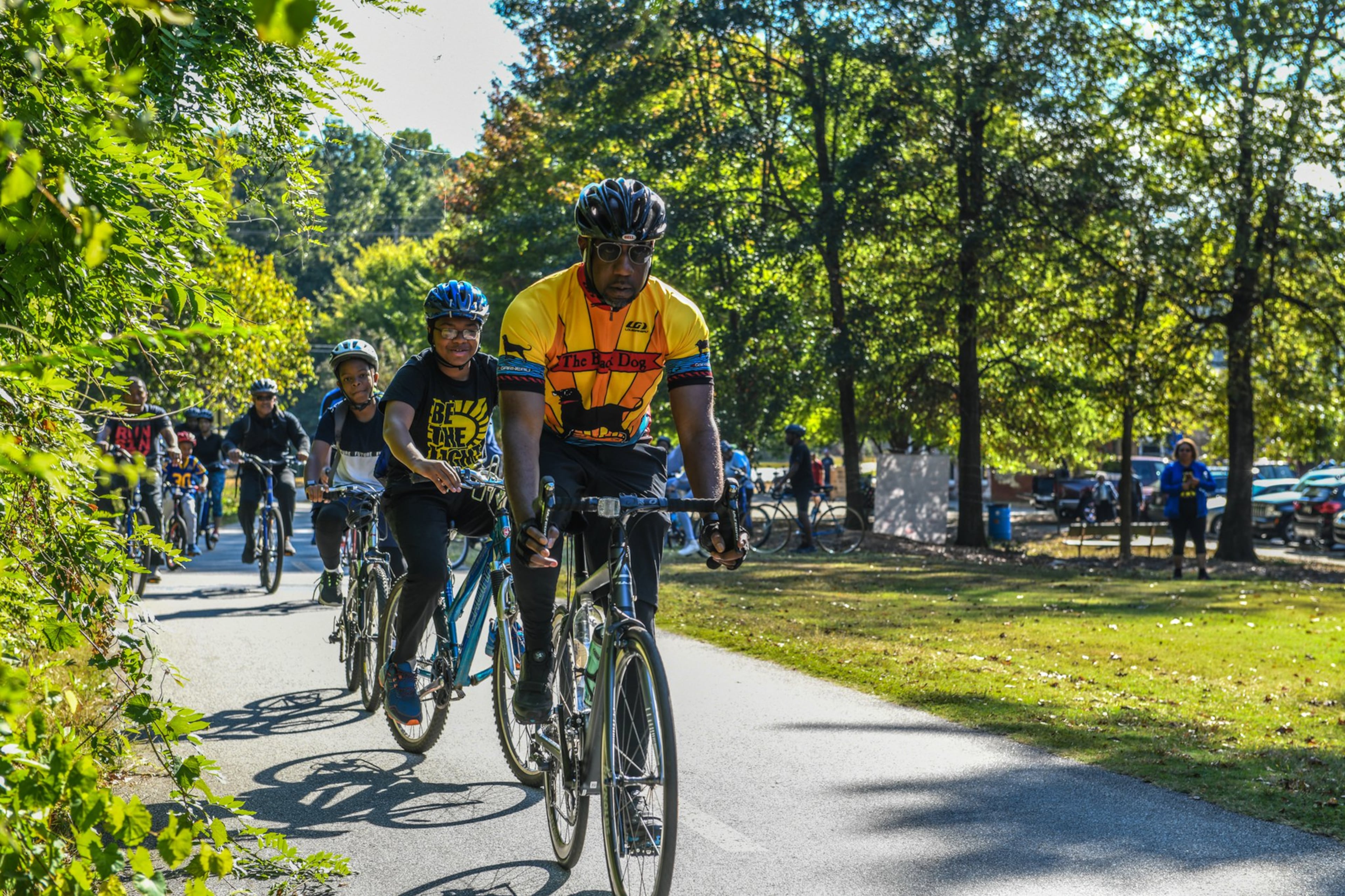 The Rev. Raphael Warnock, senior pastor of Ebenezer Baptist Church, rides along with others in the “Faith & Fitness” ministry. CONTRIBUTED
