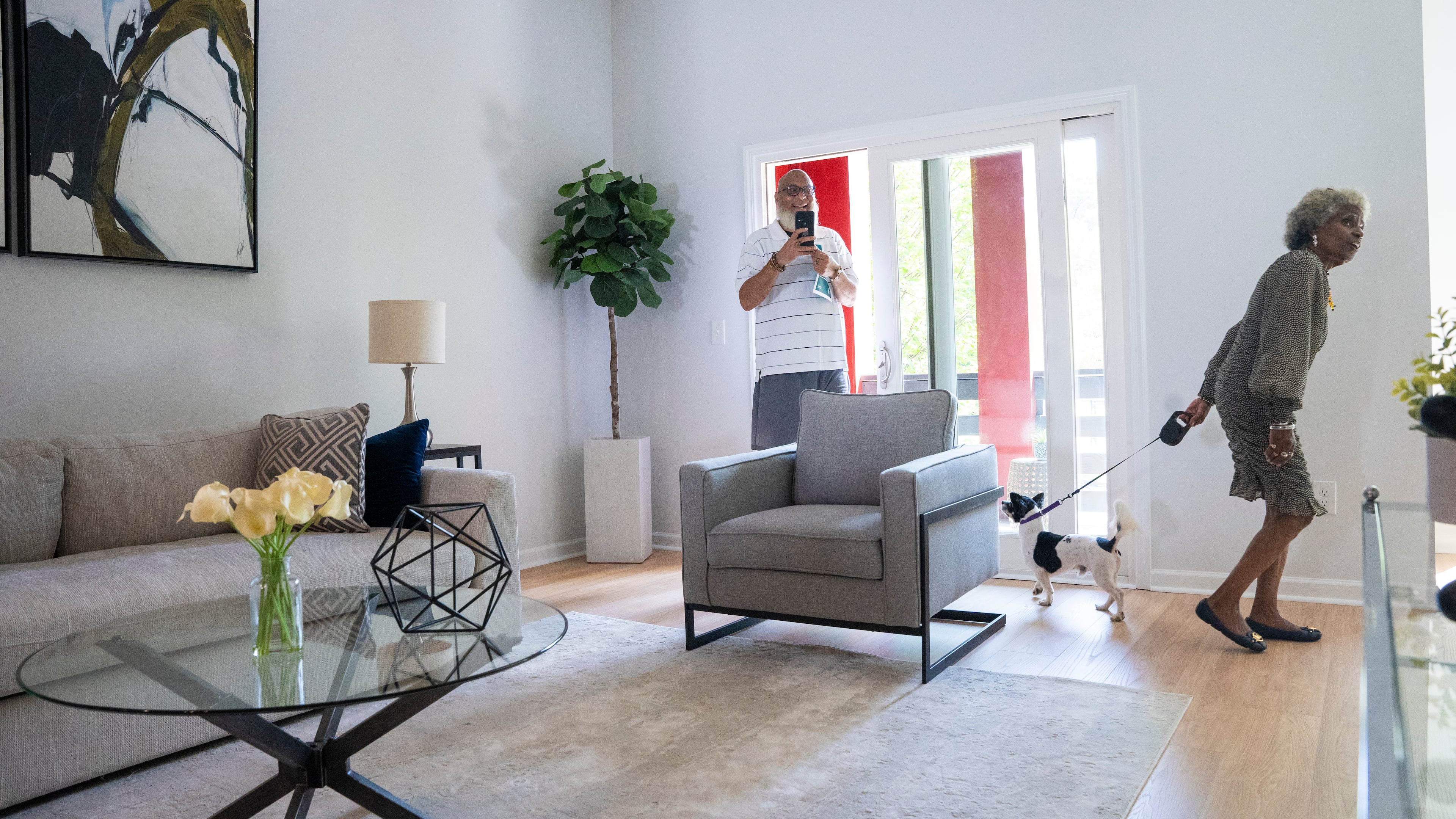 The family of Hattie B. Dorsey, founder of Atlanta Neighborhood Development Partnership Inc., tours a new condo at an unveiling event on Tuesday, Aug. 27, 2024, in Atlanta, Georgia. (Olivia Bowdoin for the AJC)