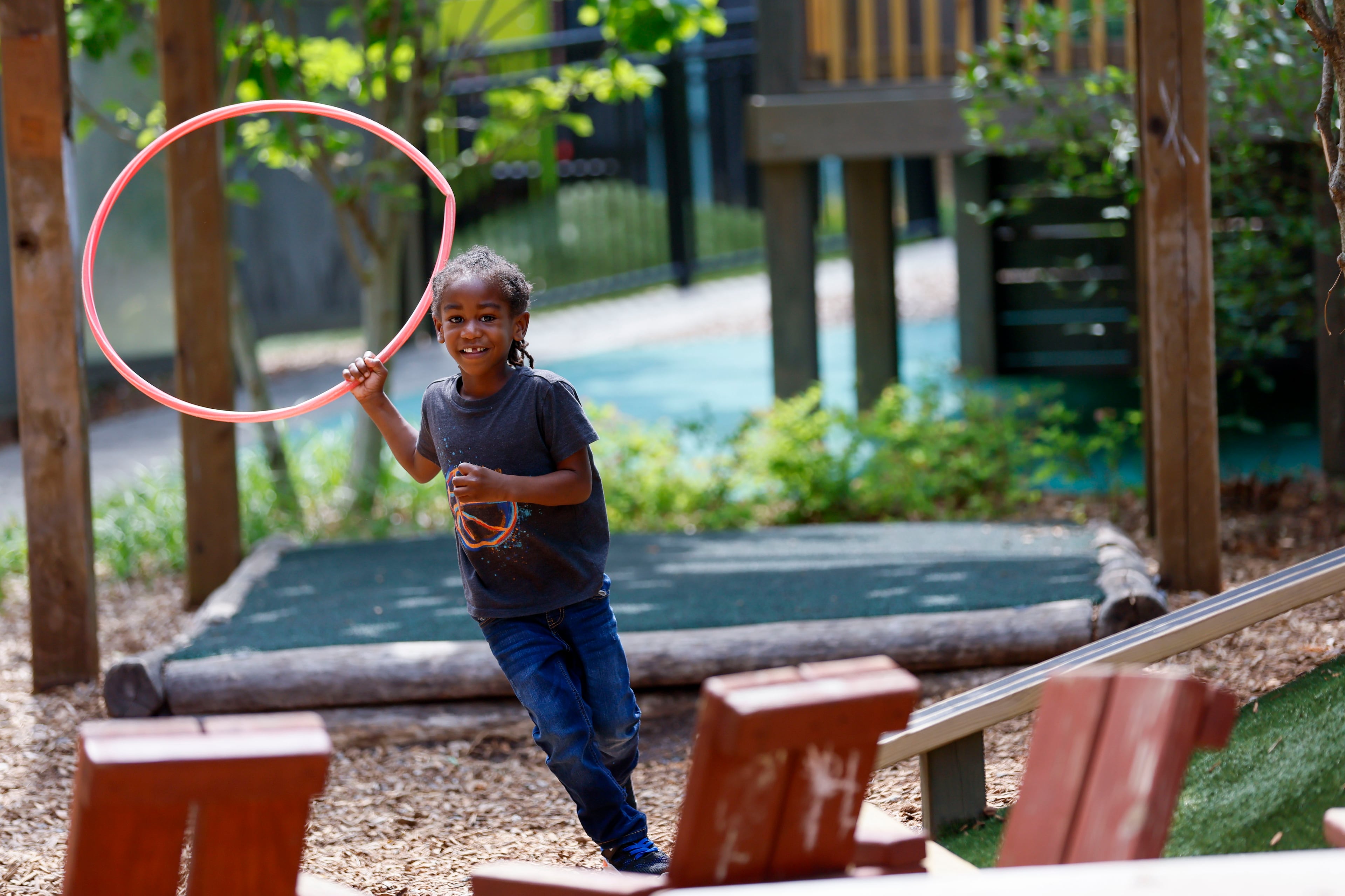 A child in the Head Start program plays outside the Arthur M. Blank Early Learning Center, Monday. (Miguel Martinez/AJC)