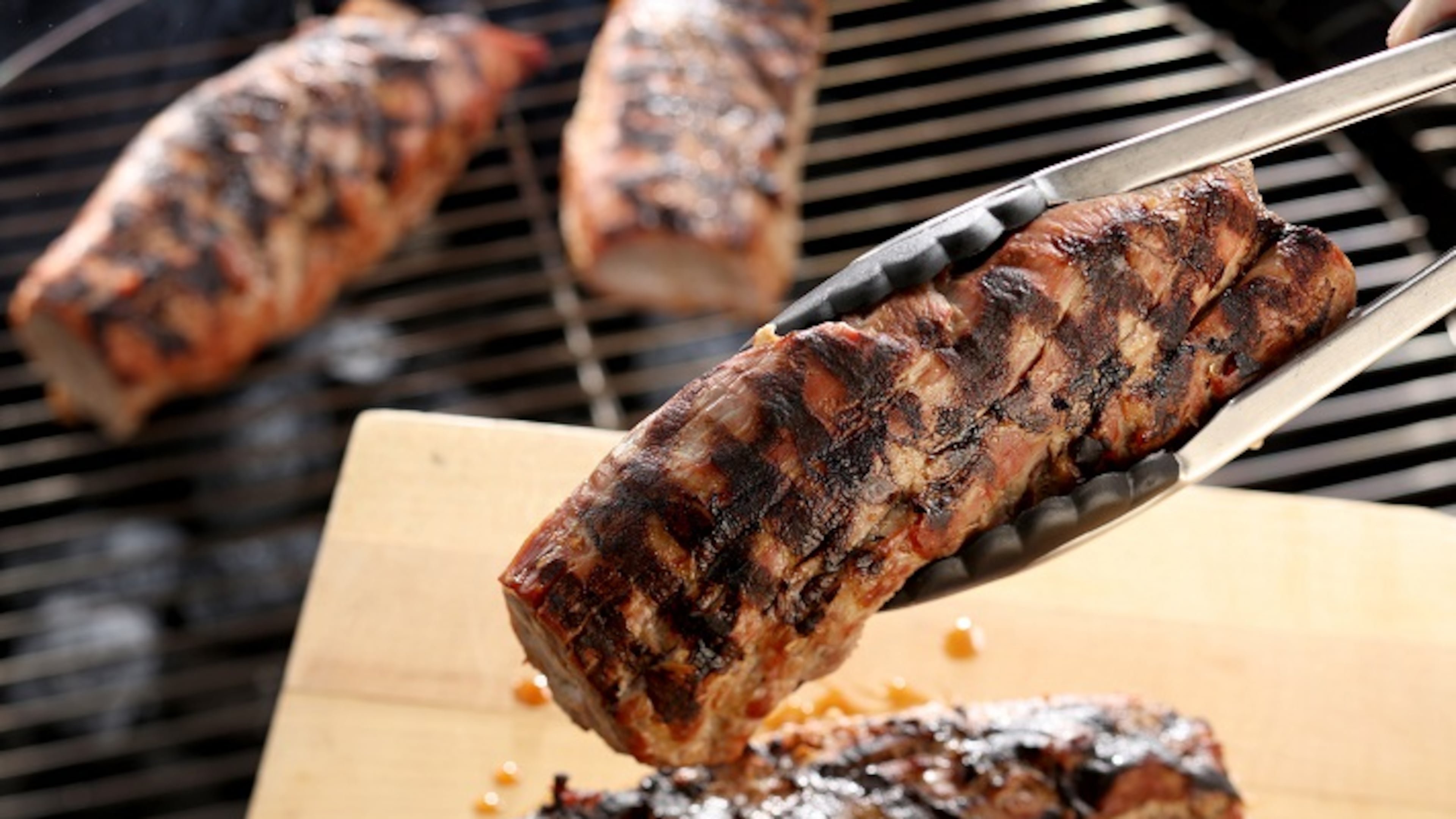 Start thinner cuts like pork tenderloins over indirect heat, then finish for a few minutes directly over the hot coals or gas flames, where you can create grill marks while you're at it. (Michael Tercha/Chicago Tribune/TNS)