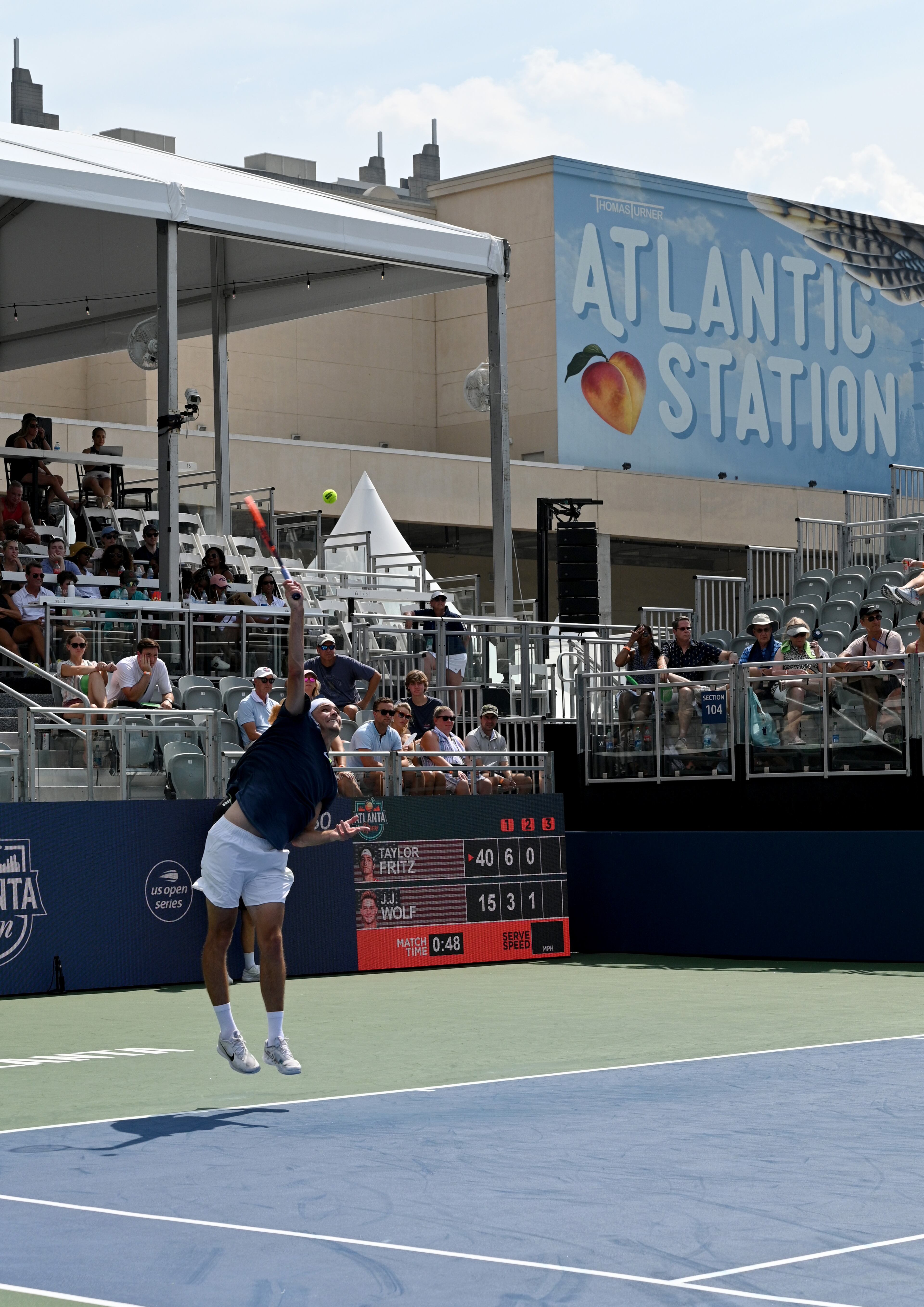 Taylor Fritz serves the ball against J.J. Wolf during a semifinal match at the 2023 Atlanta Tennis Open at Atlantic Station, Saturday, July 29, 2023, in Atlanta. (Hyosub Shin / Hyosub.Shin@ajc.com)