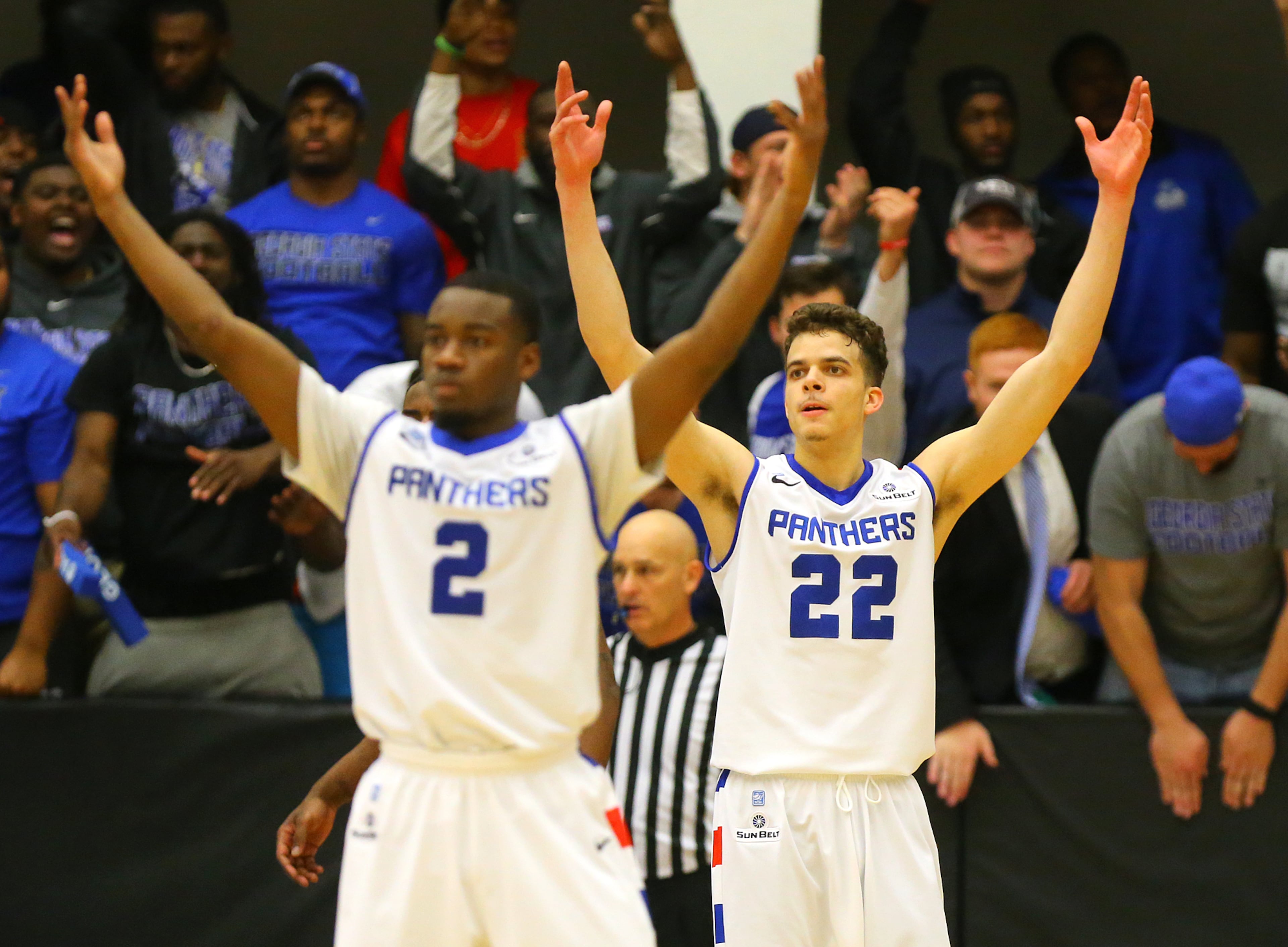 Georgia State guards Ryann Green (left) and R.J. Hunter urge the crowd to make some noise during a basketball game against Georgia Southern on Saturday, March 7, 2015, in Atlanta.