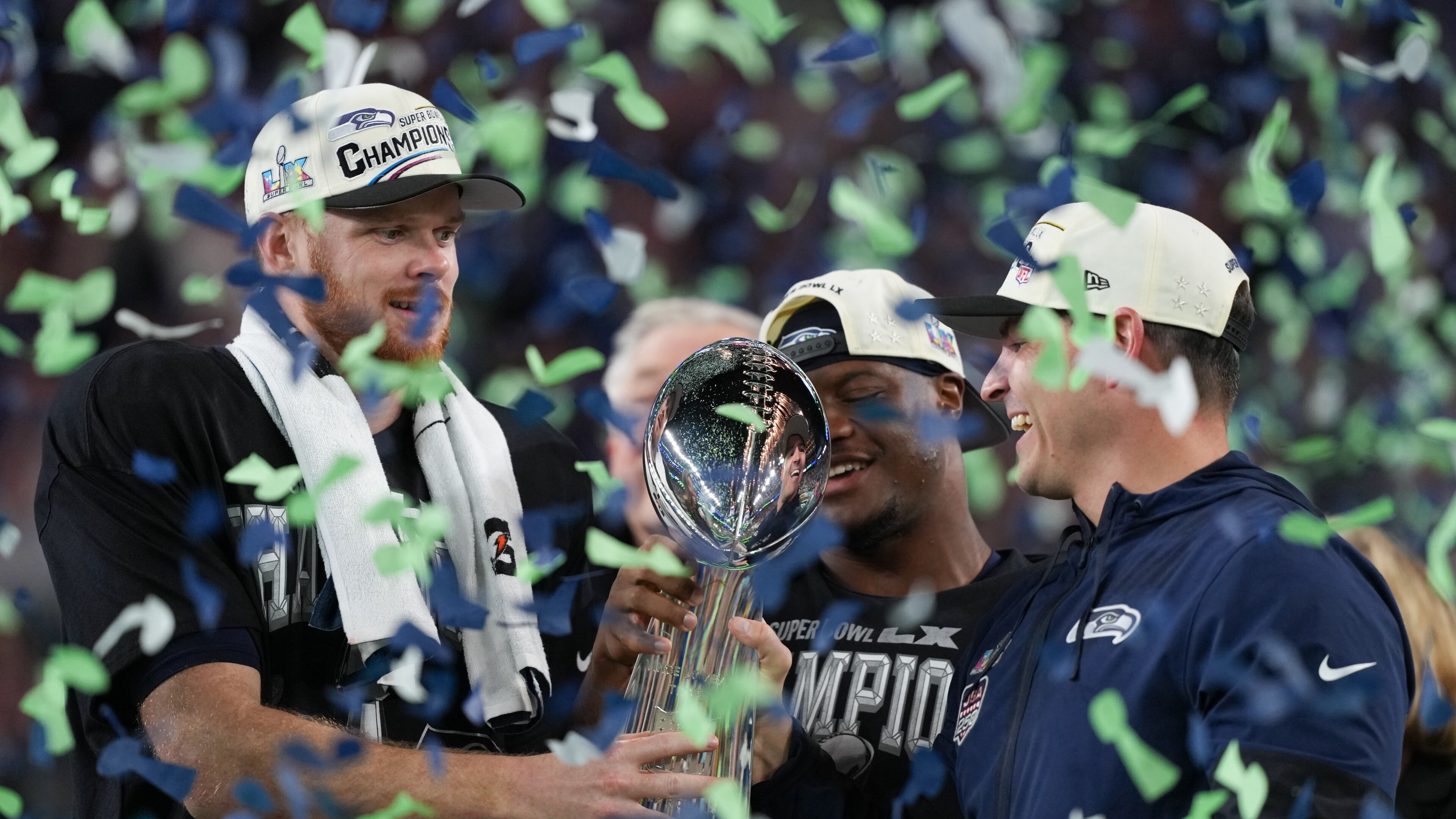 Seattle Seahawks head coach Mike Macdonald and quarterback Sam Darnold, left, hold the Lombardi Trophy after a win over the New England Patriots in the NFL Super Bowl 60 football game Sunday, Feb. 8, 2026, in Santa Clara, Calif. (AP Photo/Matt Slocum)