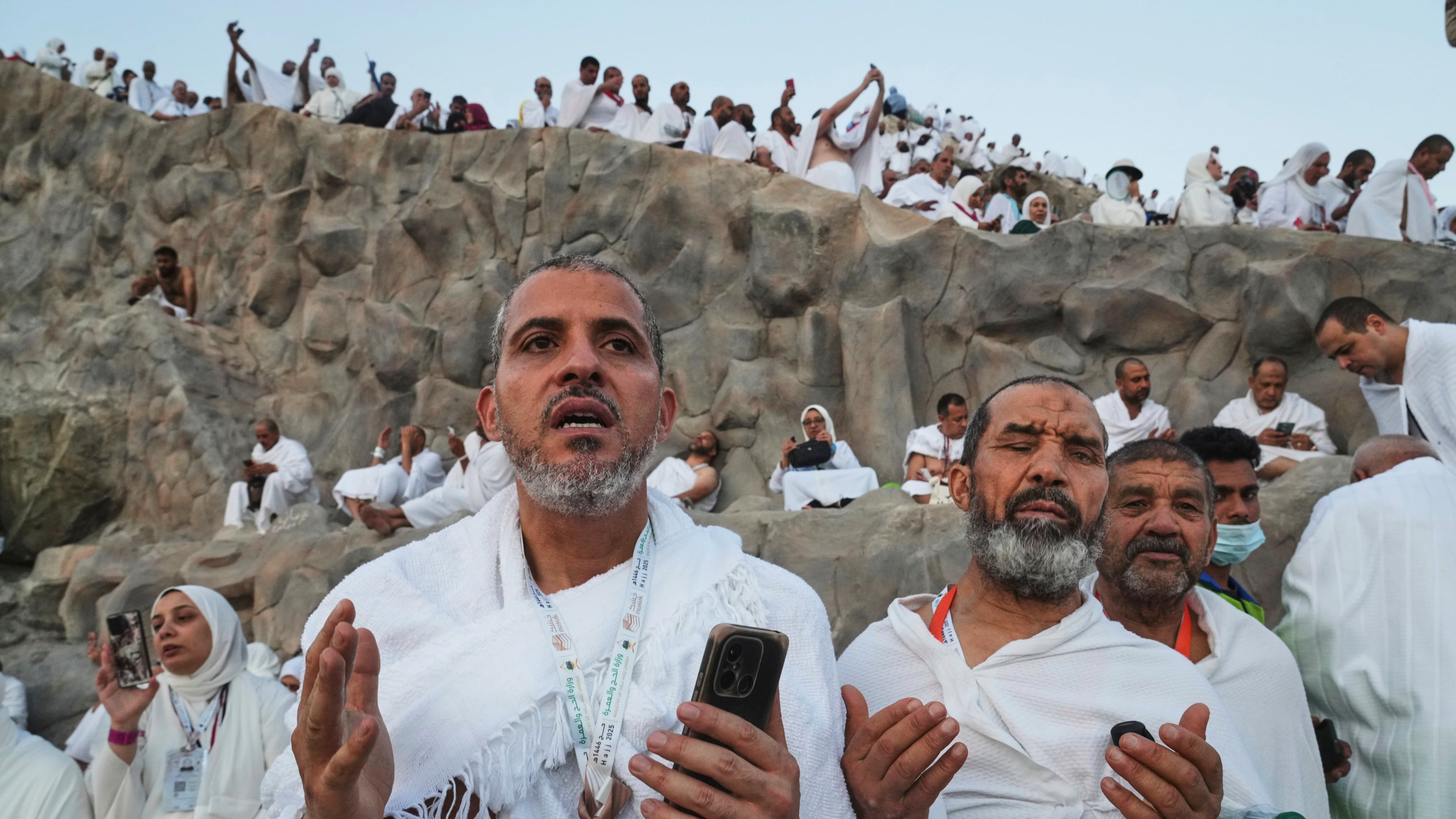 FILE - Muslim pilgrims offer prayers on the Mountain of Mercy, on the Plain of Arafat, during the annual Hajj pilgrimage near the holy city of Mecca, Saudi Arabia, June 5, 2025. (AP Photo/Amr Nabil, File)