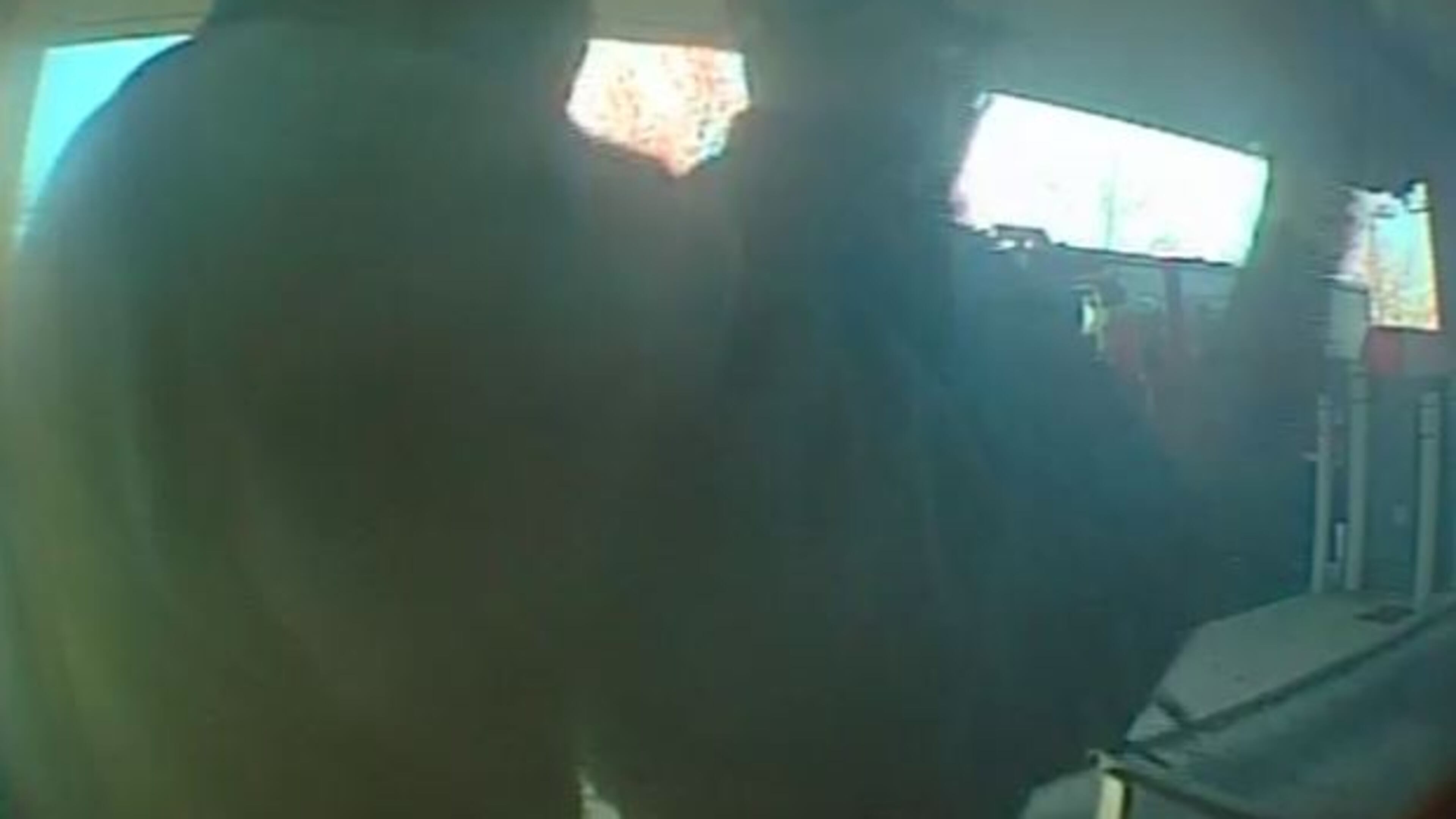 A surveillance photo of a man robbing an armored-car courier in DeKalb County. (Credit: FBI)