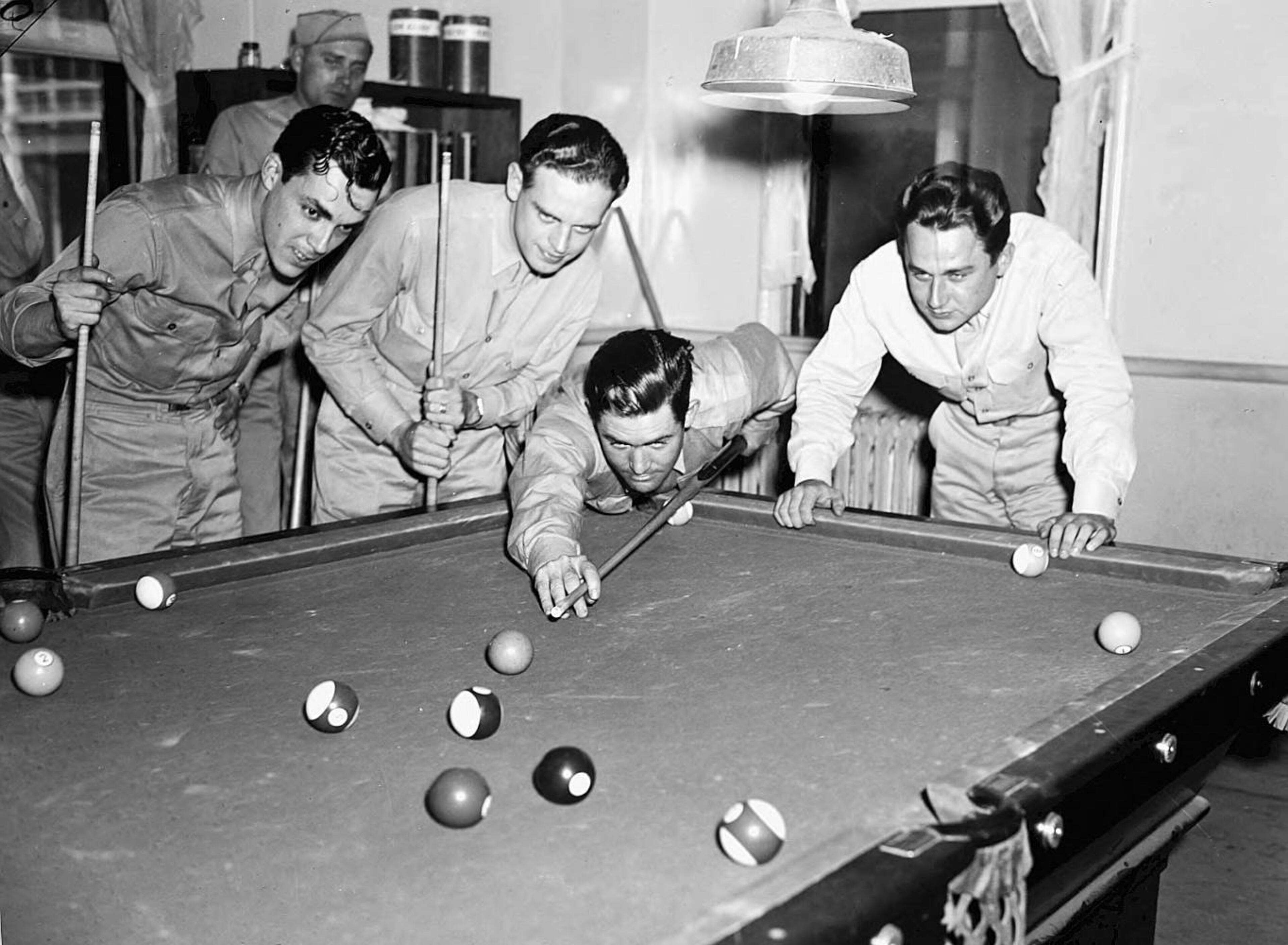 Off-duty soldiers shooting pool in an USO Service Men's Center, Atlanta, Georgia, 1942. LBCB111-063d, Lane Brothers Commercial Photographers Photographic Collection, 1920-1976. Photographic Collection, Special Collections and Archives, Georgia State University Library.