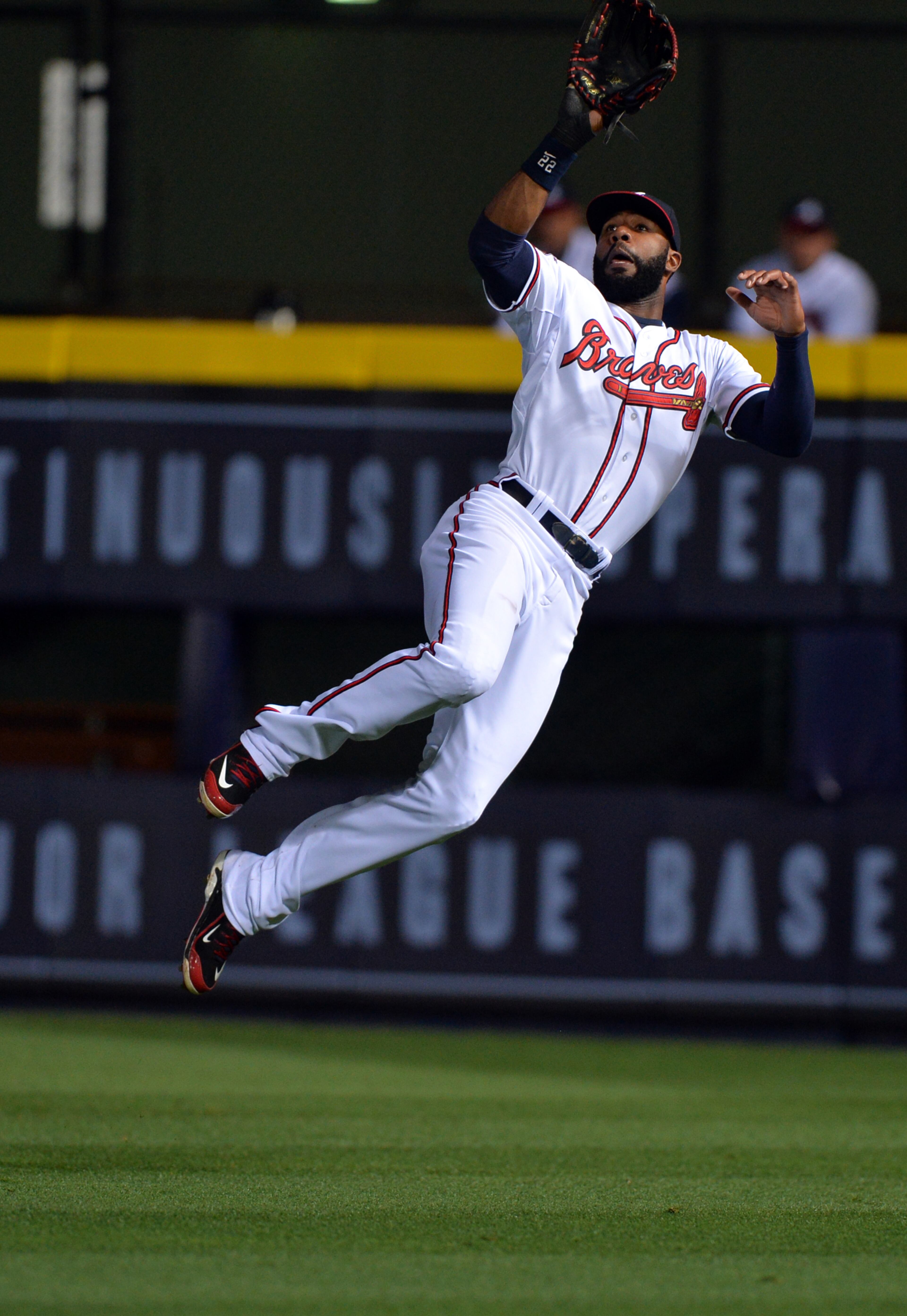 Atlanta Braves right fielder Jason Heyward makes a leaping catch in the 6th inning off the bat of Chicago Cubs John Baker at Turner Field Friday May 9, 2014. BRANT SANDERLIN /BSANDERLIN@AJC.COM
